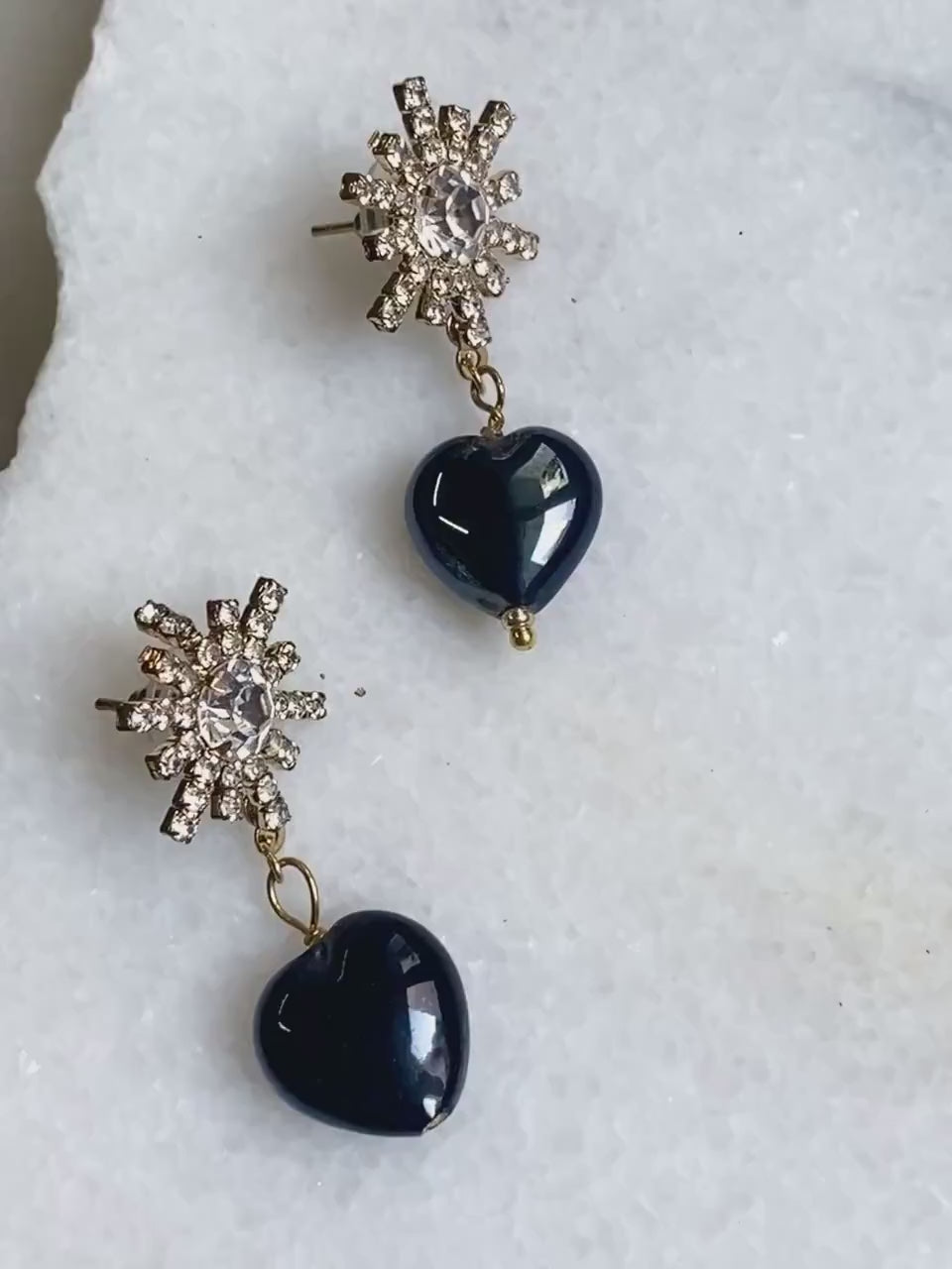 Crystal star earrings with black hearts