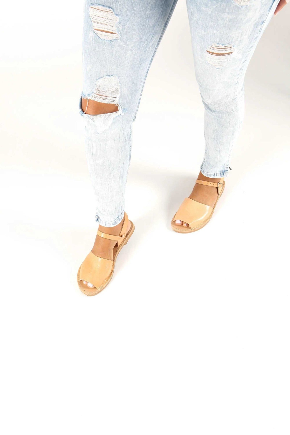 CLEO Handmade Greek Sandals in natural tan leather with wide straps, closed toes, and low flat soles