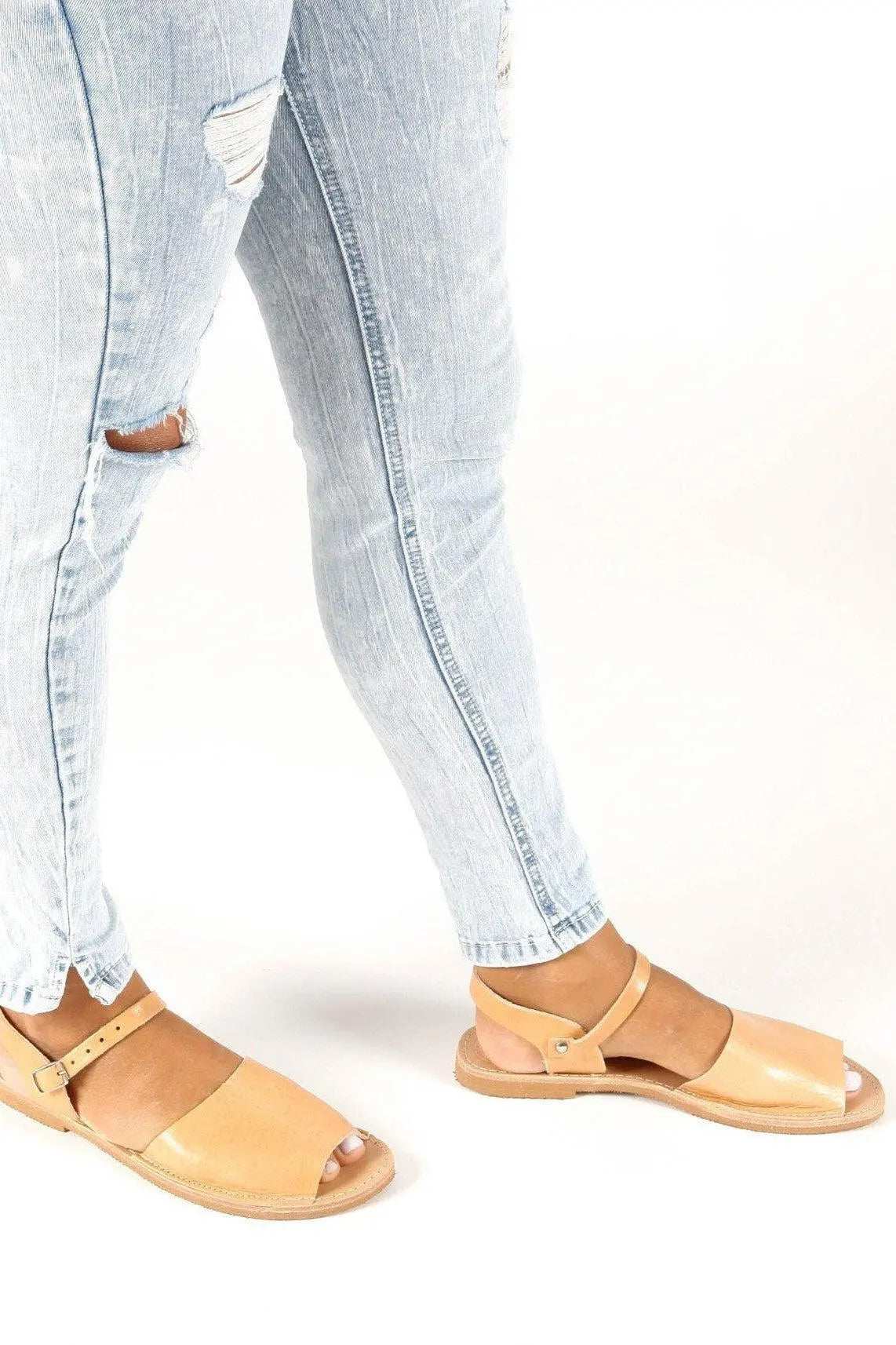 CLEO Handmade Greek Sandals in natural tan leather with flat soles, open toes and buckled ankle straps