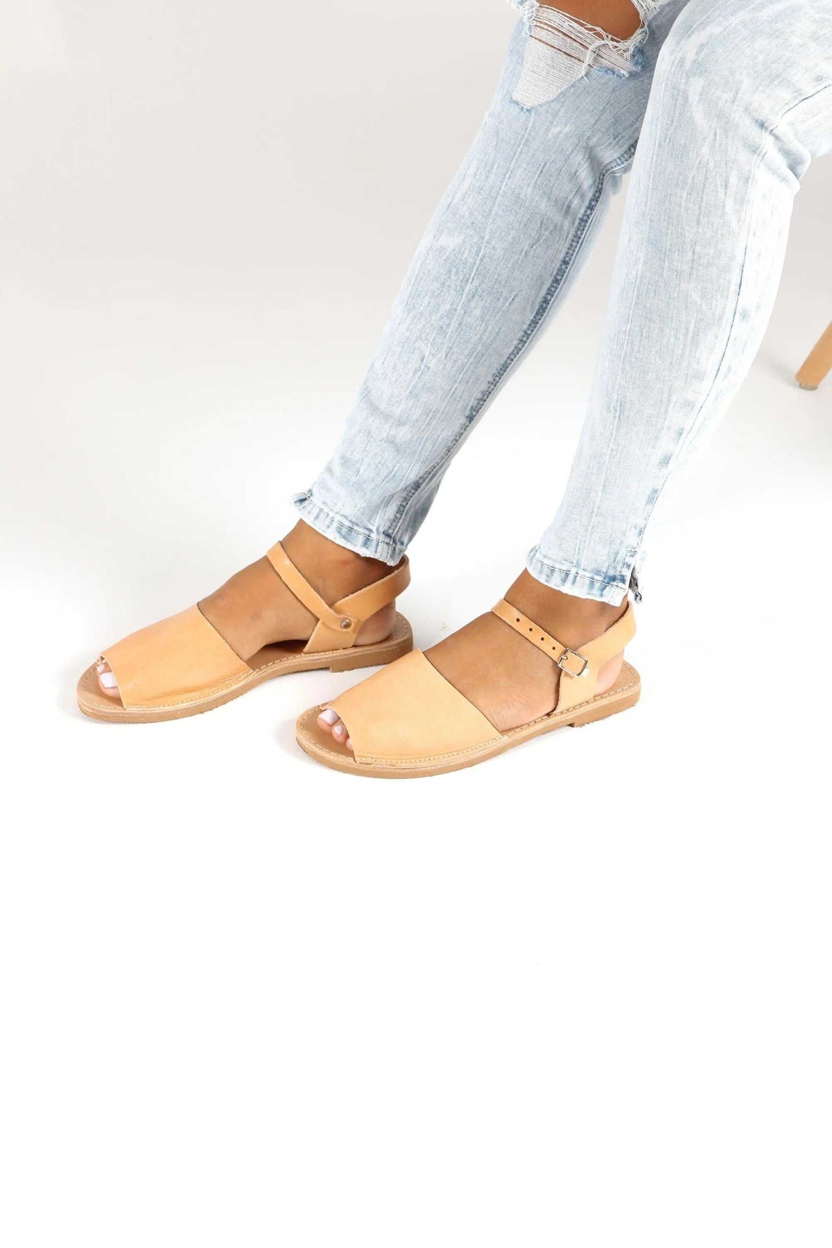 CLEO Handmade Greek Sandals in natural tan leather with flat soles, broad toe straps and buckled ankle straps