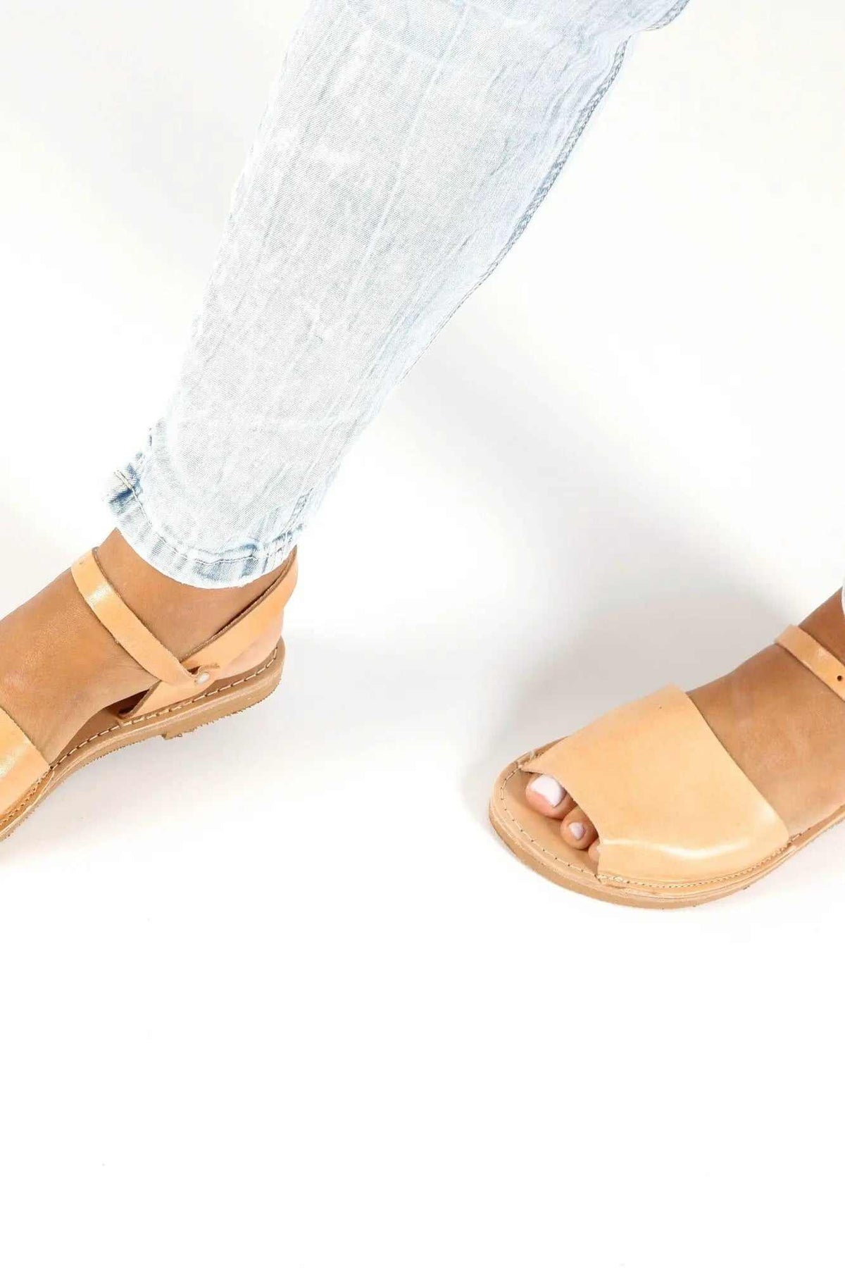 CLEO Handmade Greek Sandals in natural tan leather with broad toe straps, slim ankle straps, and flat soles