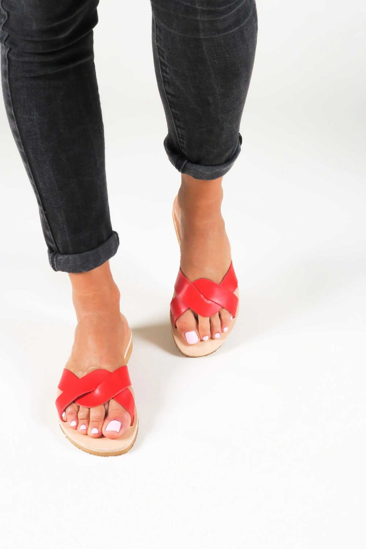 CYNTHIA Handmade Greek Sandals in red leather with crossed straps, open toes, and textured rubber soles