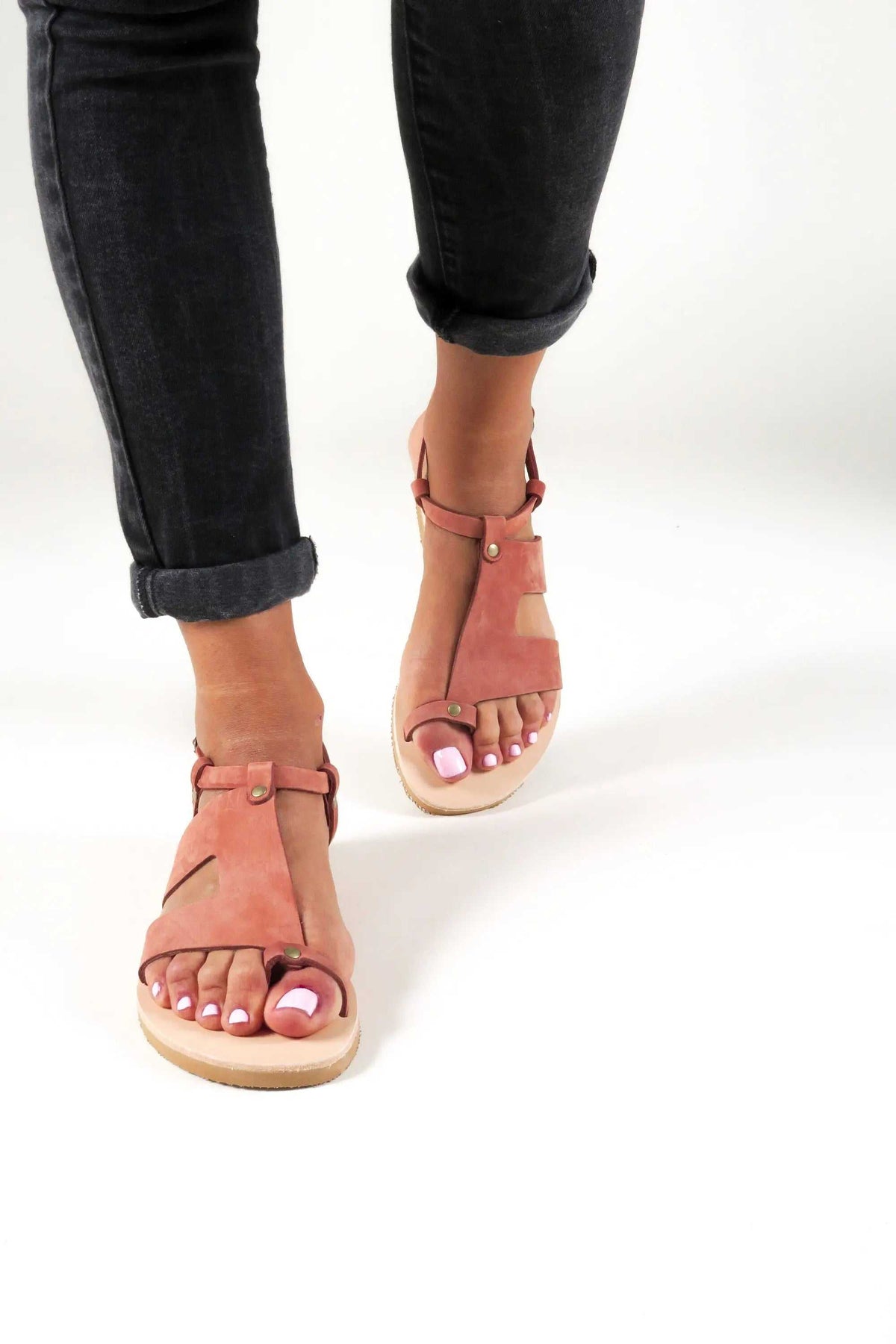 DELOS Handmade Greek Sandals in brick-red leather with slim straps, gold-tone buckles and a natural leather sole