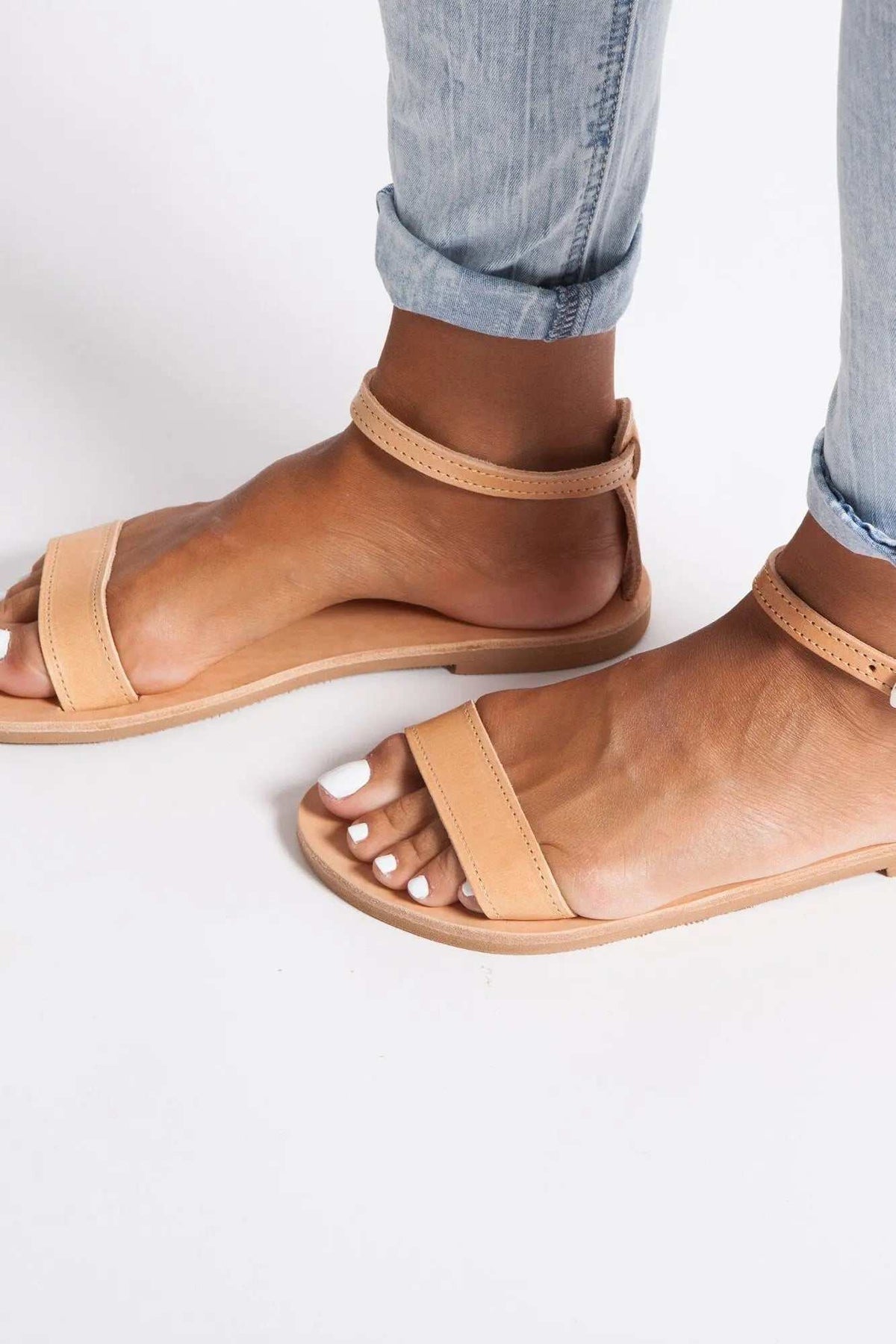 ELIA Handmade Greek Sandals in natural tan leather with simple straps, ankle loops, and flat soles