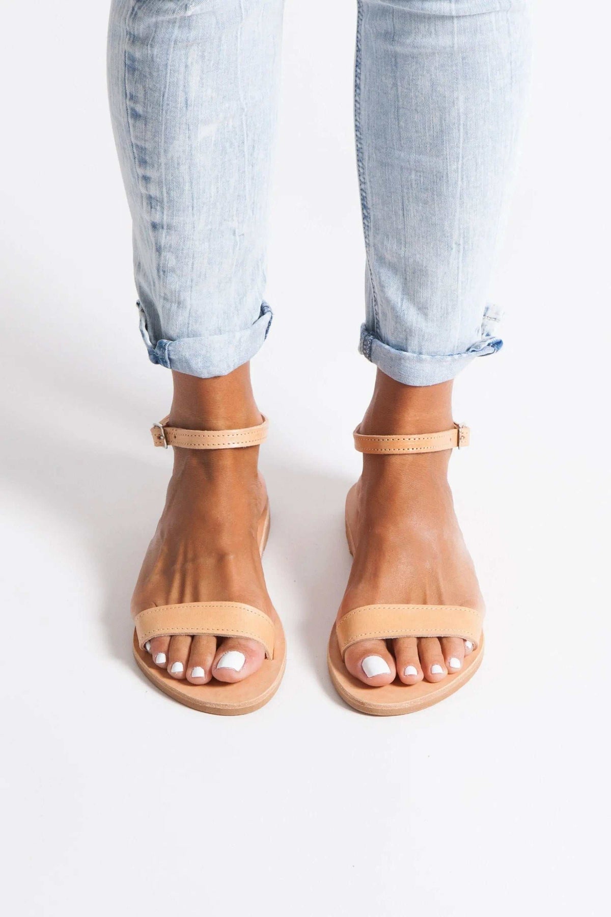 ELIA Handmade Greek Sandals in natural tan leather, with a simple toe strap, ankle strap and flat sole