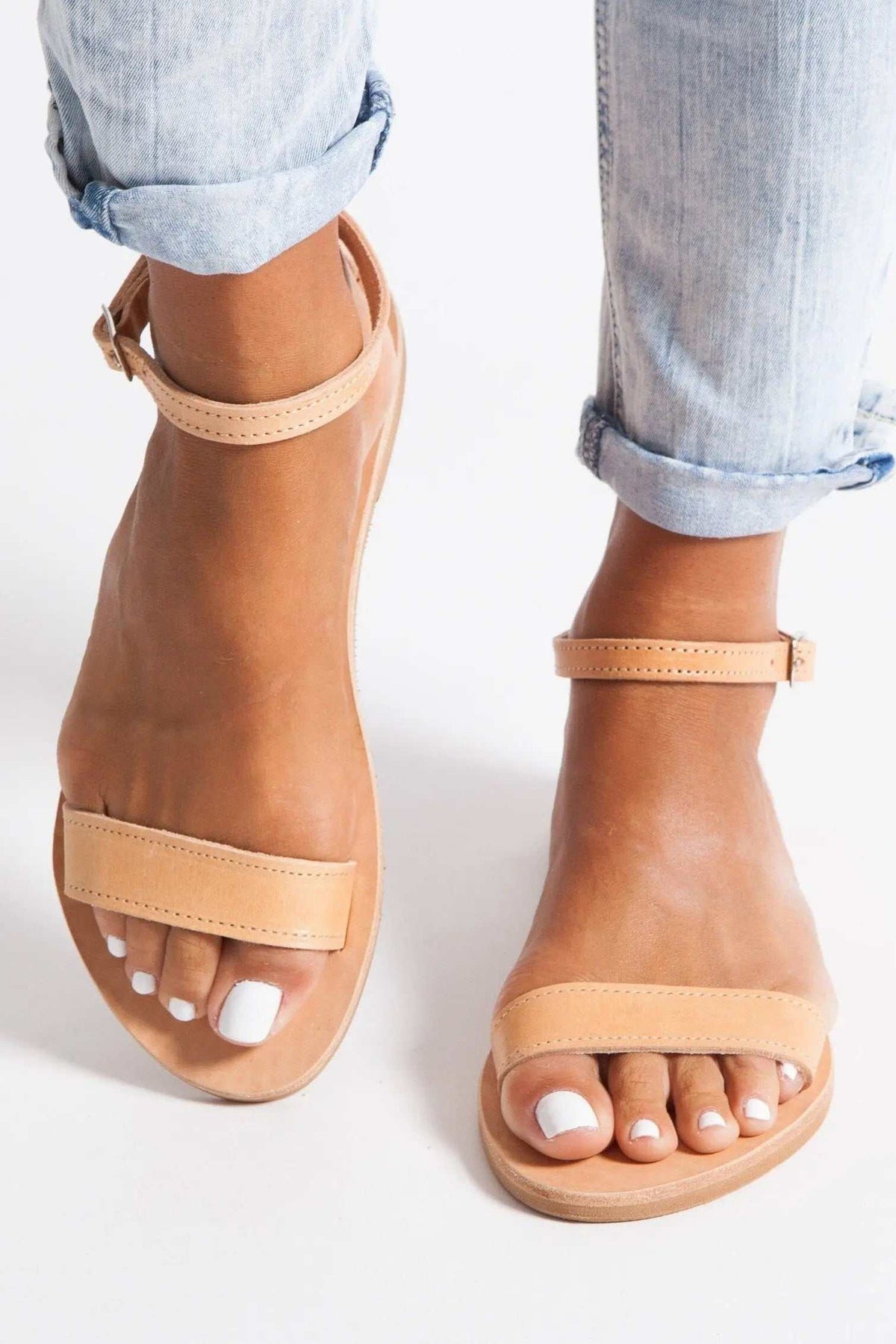 ELIA Handmade Greek Sandals in natural tan leather with slim straps, stitched edges, and an open-toe design