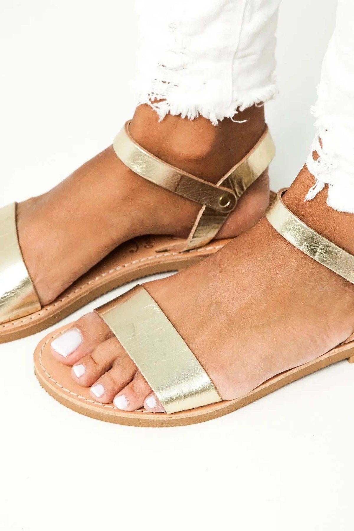 ELOUNDA Handmade Greek Sandals in metallic gold leather with multiple straps and an ankle buckle