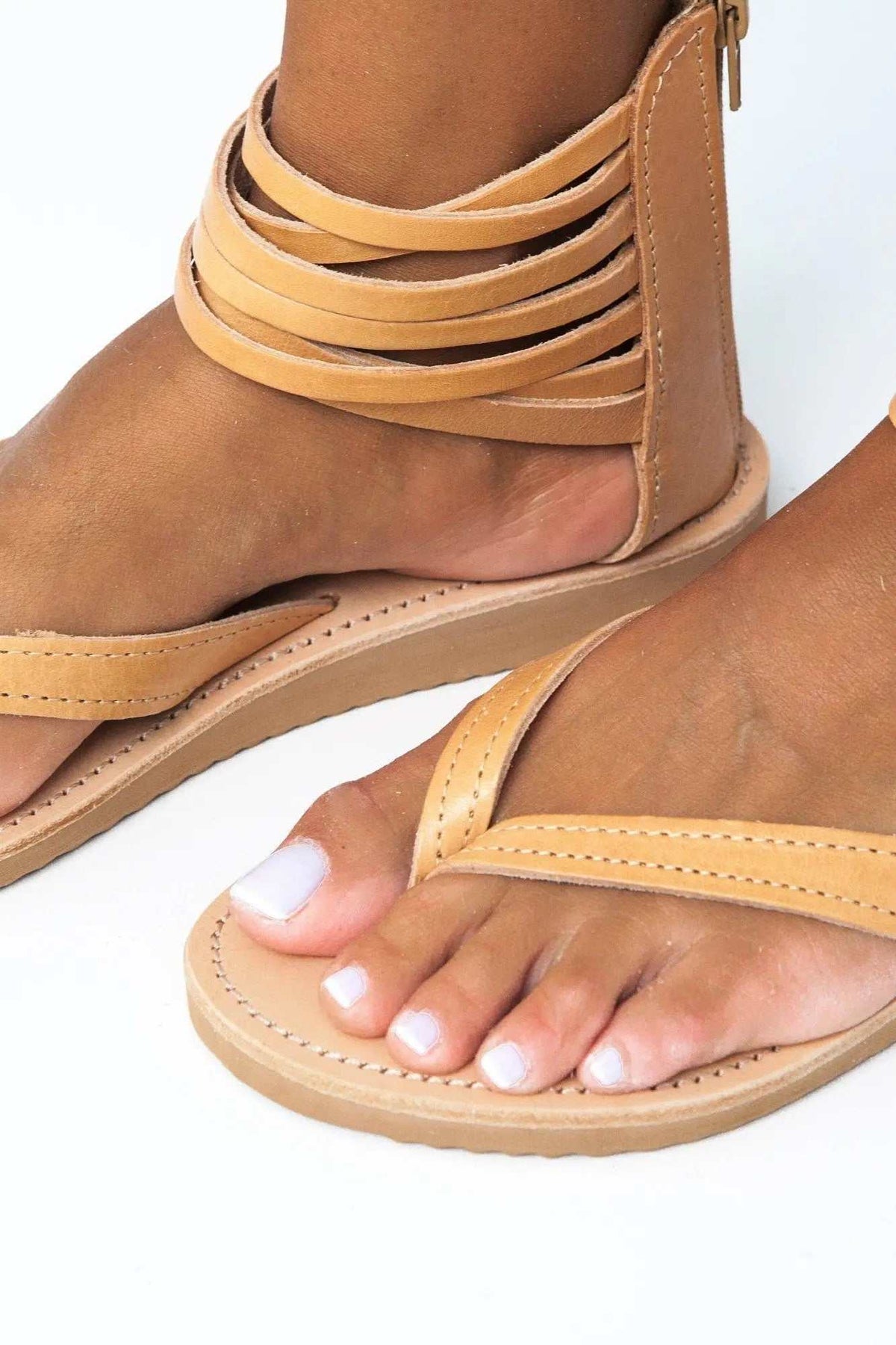 ERMIS Handmade Greek Sandals in tan leather with layered ankle straps, stitched footbeds and a flat sole