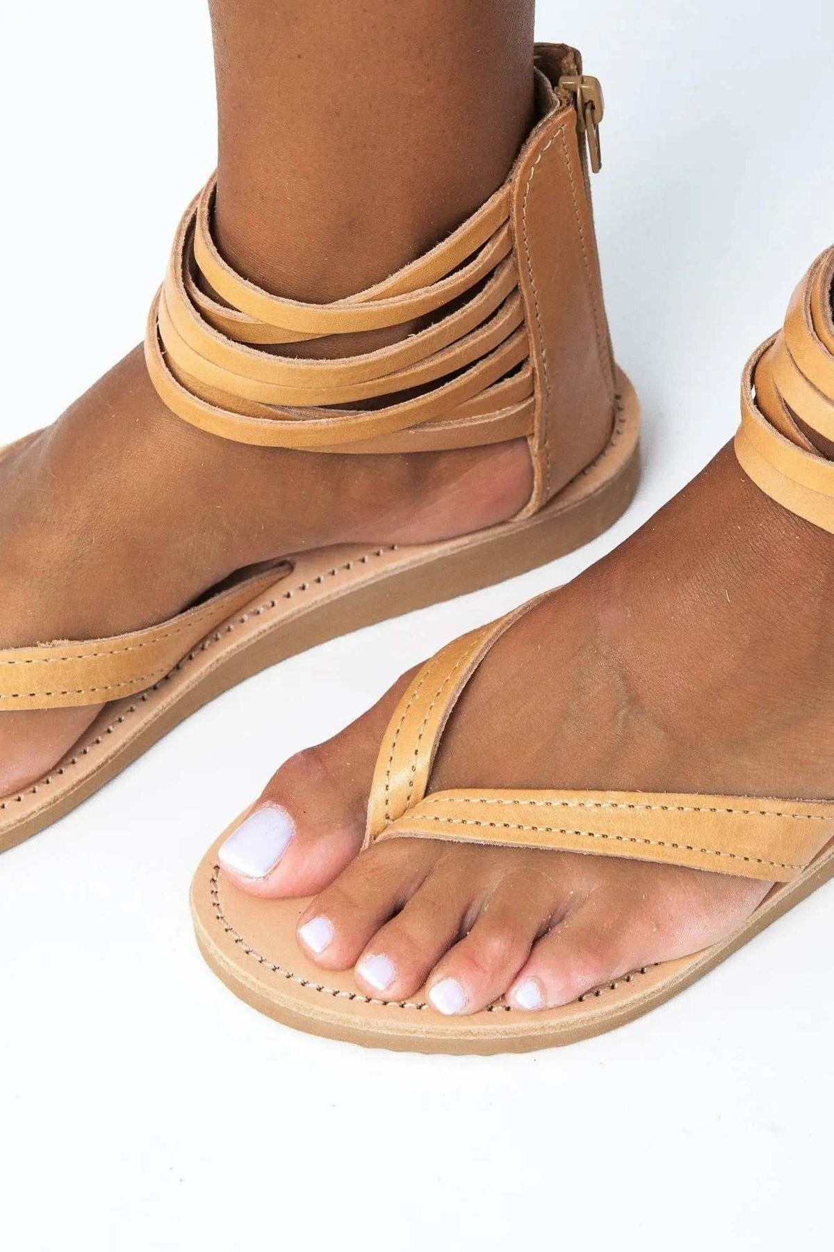 ERMIS Handmade Greek Sandals in natural tan leather with layered ankle straps, stitched footbeds and a flat sole