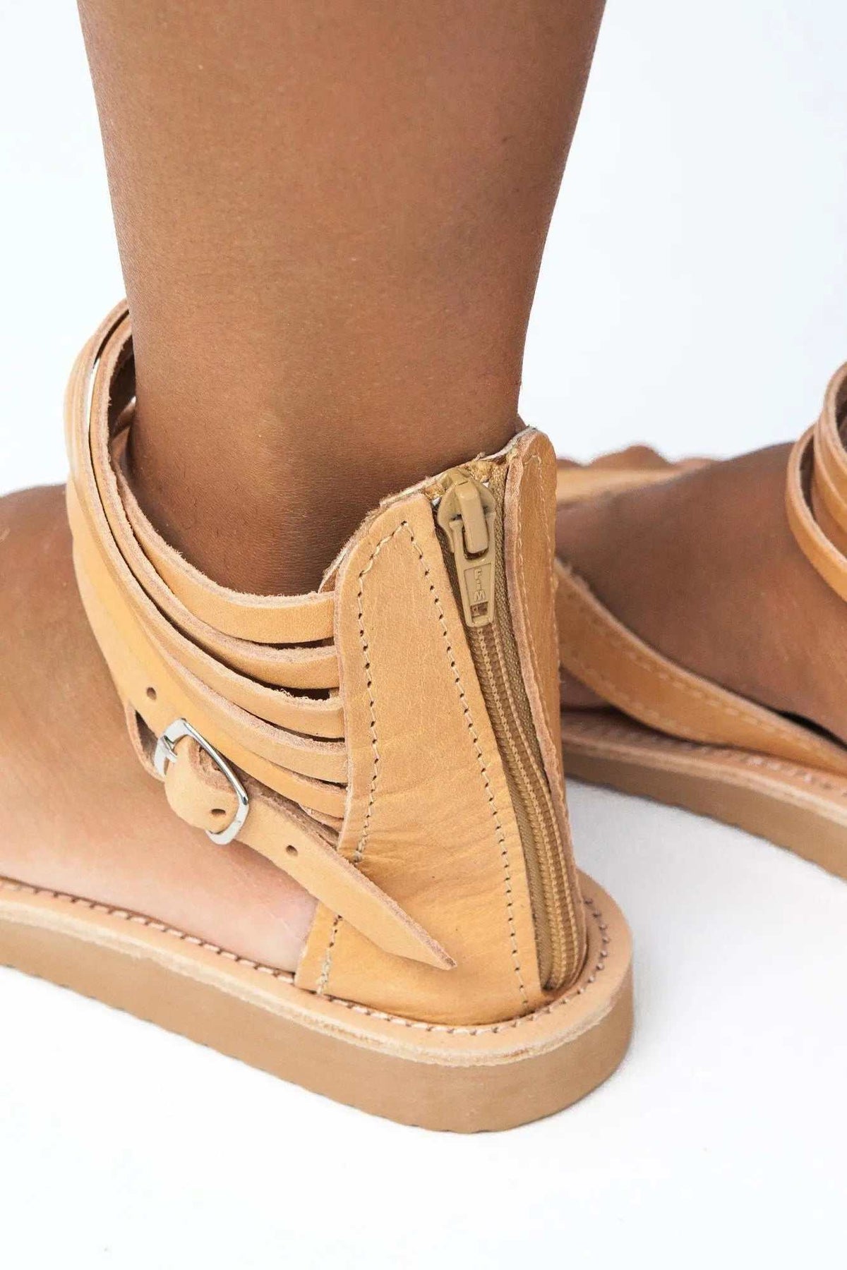 ERMIS Handmade Greek Sandals in tan leather with layered ankle straps, a side zipper, buckle detail and flat sole
