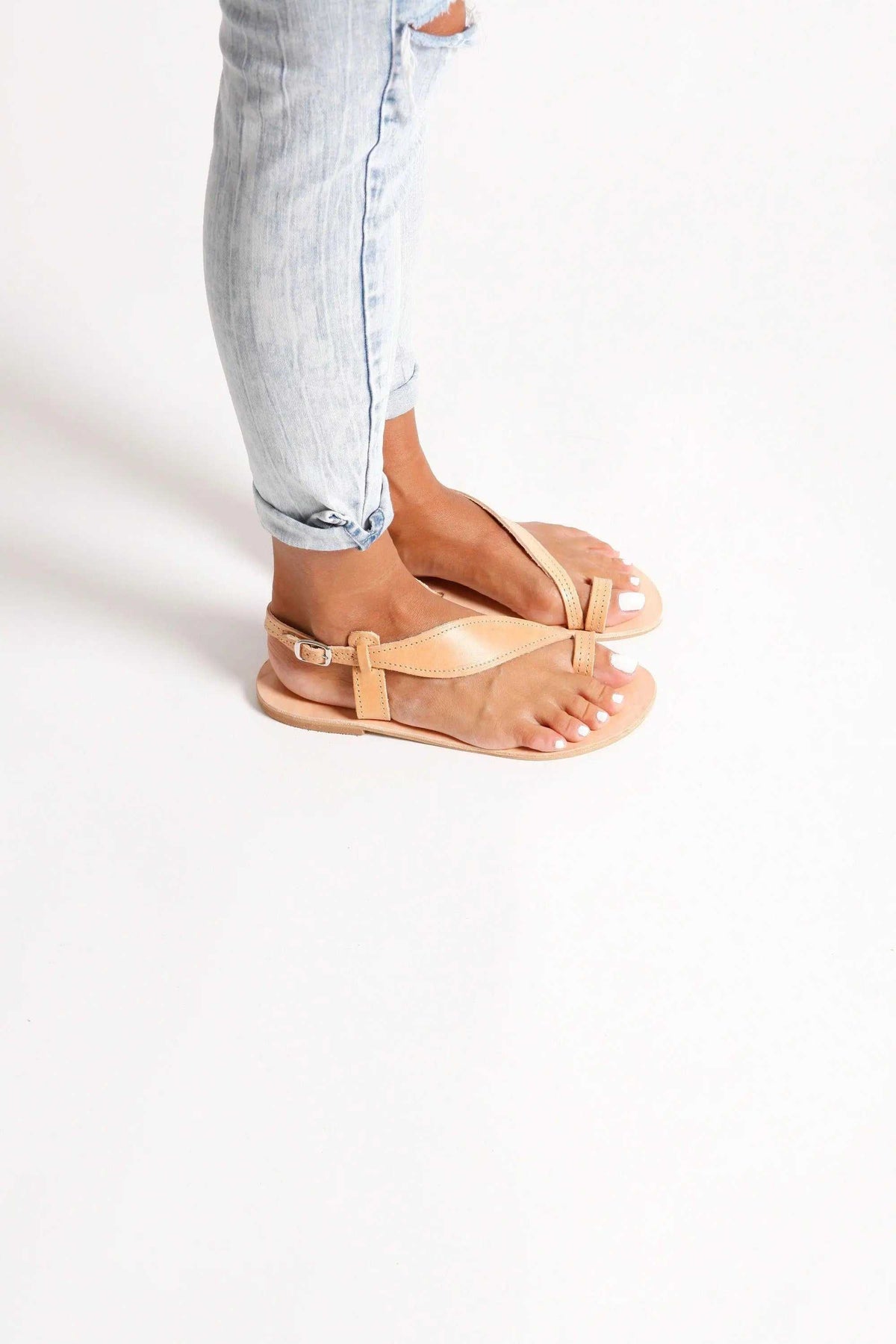 FILO Handmade Greek Sandals in natural tan leather with slim straps, toe loops, and delicate ankle straps