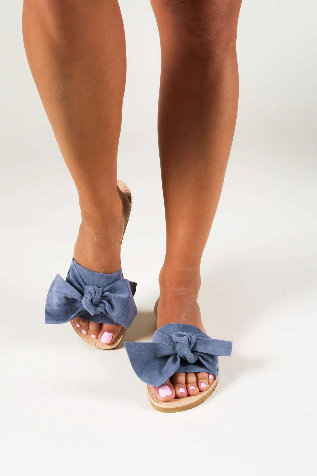 FIOGOS Handmade Greek Sandals with blue denim bow straps, open toes, and natural leather soles