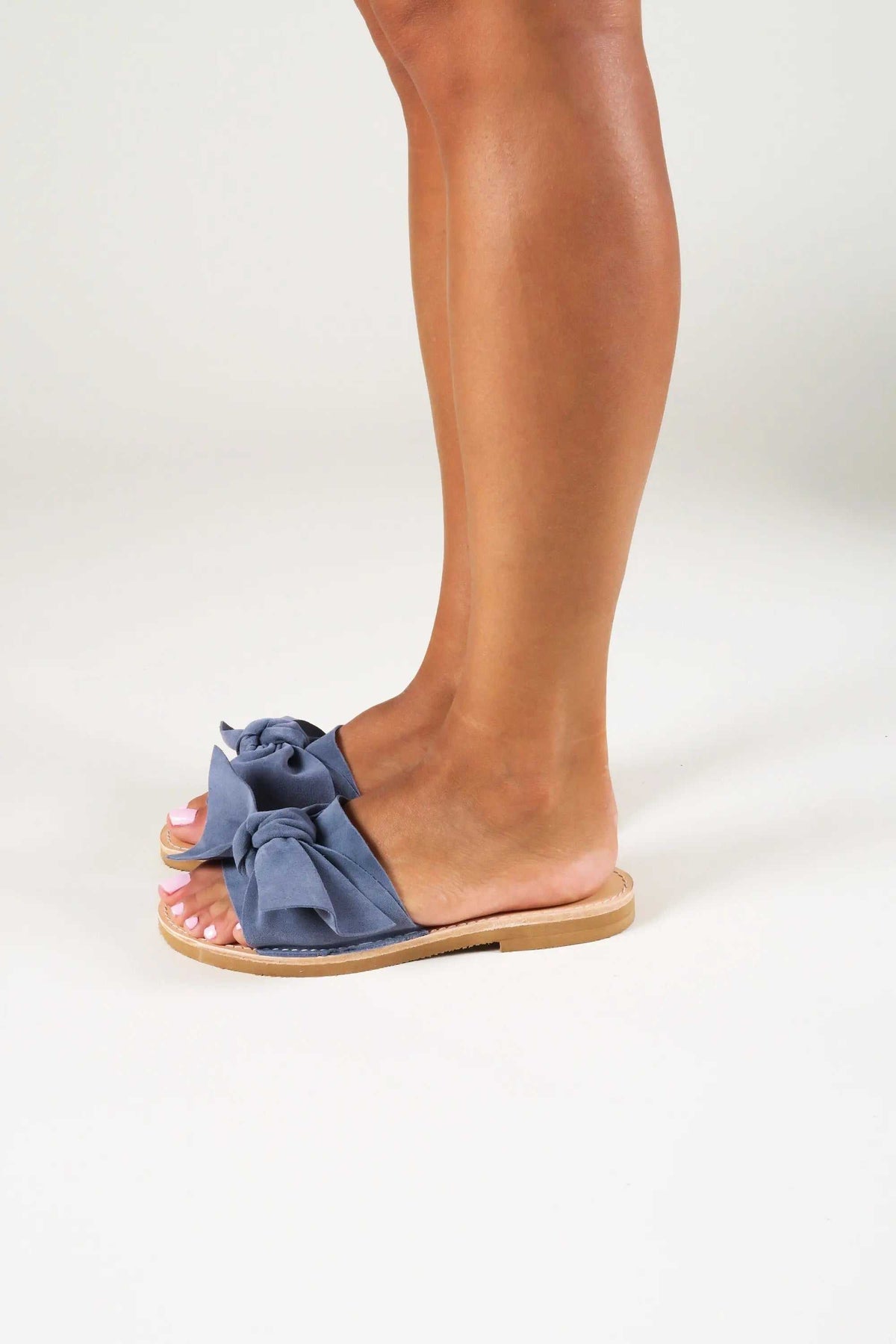 FIOGOS Handmade Greek Sandals in blue suede with oversized bow straps, natural leather insole and flat sole