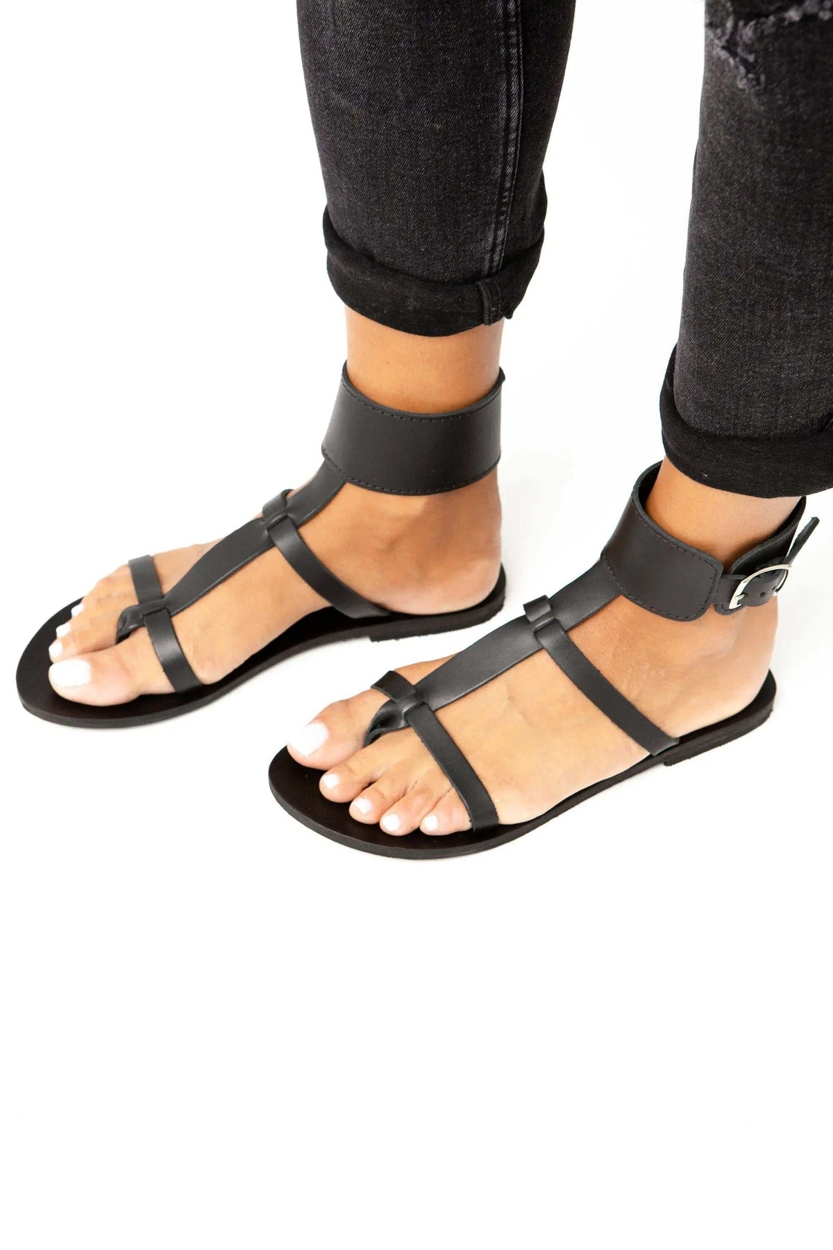 IFESTOS Handmade Greek Sandals in black leather with ankle cuffs, cross straps, buckles and flat soles