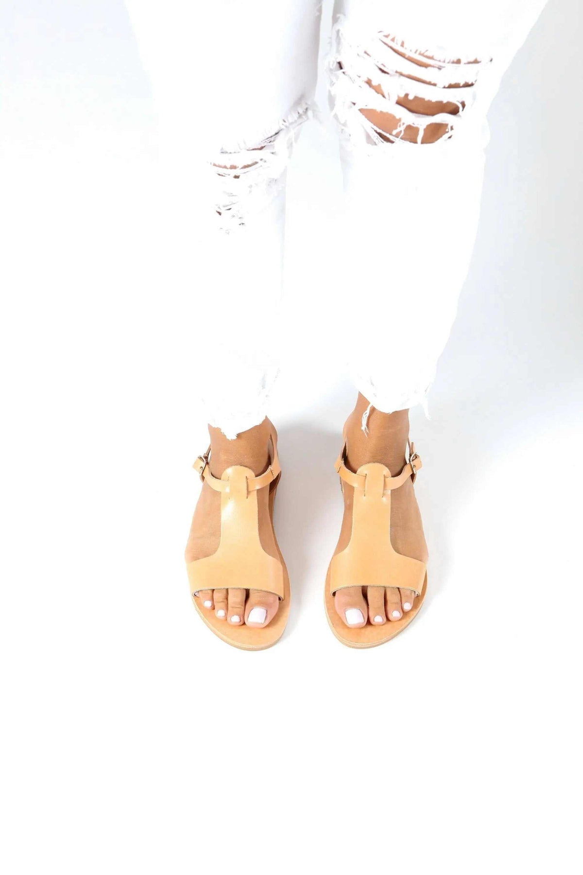 IFIGENE Handmade Greek Sandals in tan leather, with a wide front strap, ankle straps, and open toes.