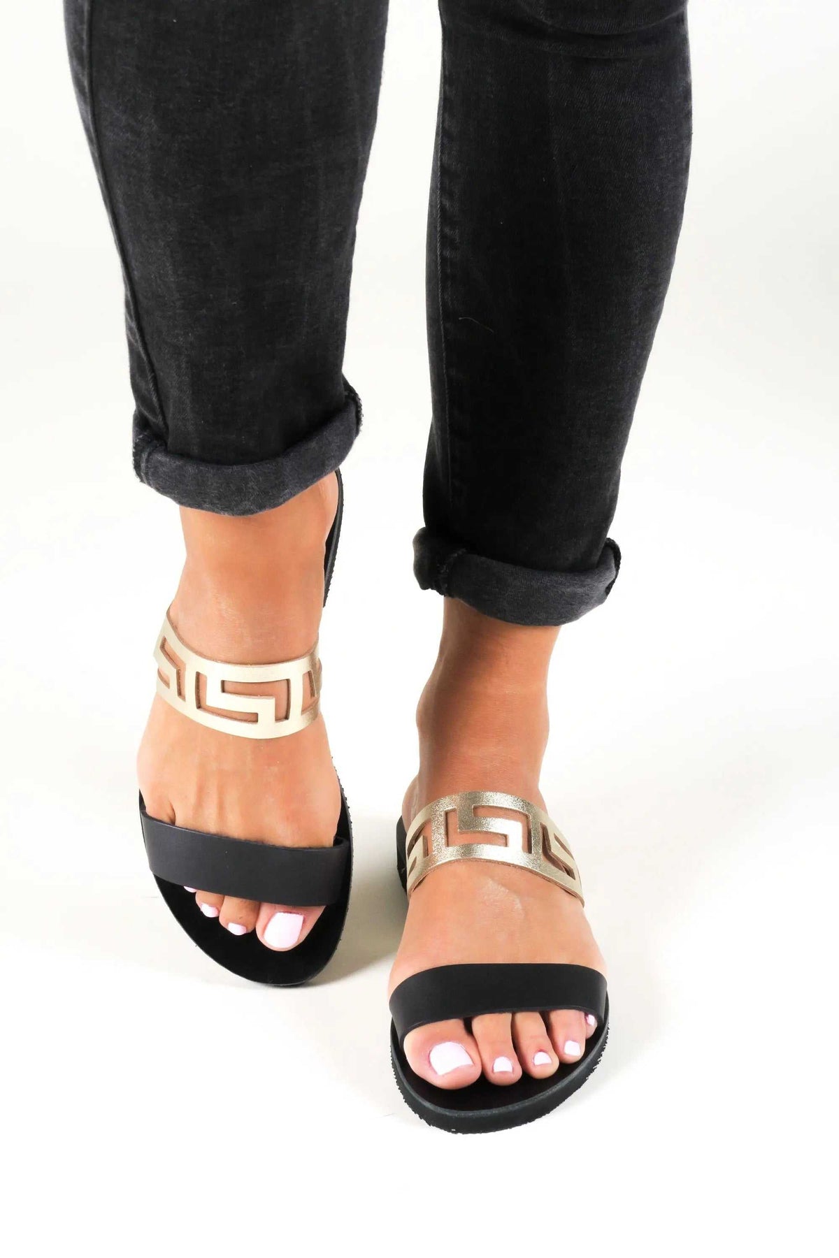 KNOSSOS Handmade Greek Sandals in black leather with golden Meander-pattern straps and open toes