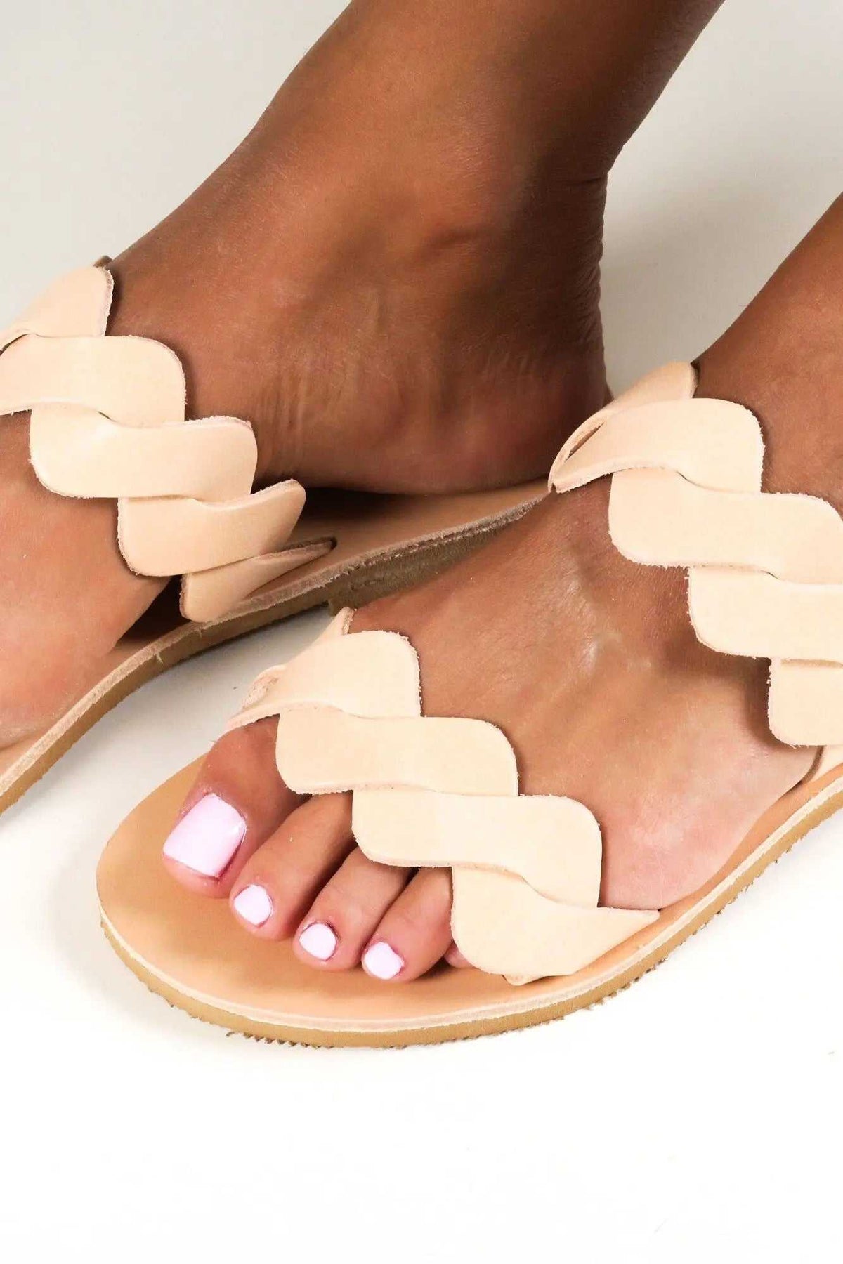 KYMA Handmade Greek Sandals in natural beige leather with braided straps, flat soles, and open-toe design