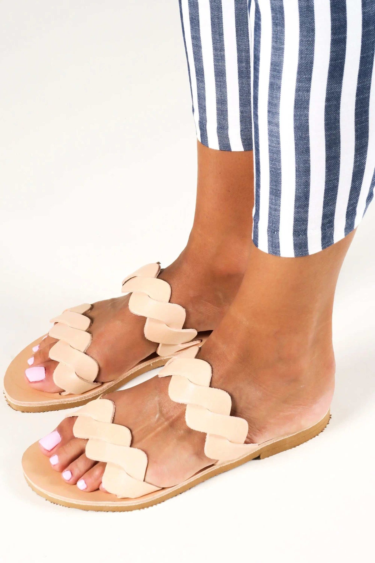 KYMA Handmade Greek Sandals in natural beige leather, with flat soles and distinctive interwoven strap detailing