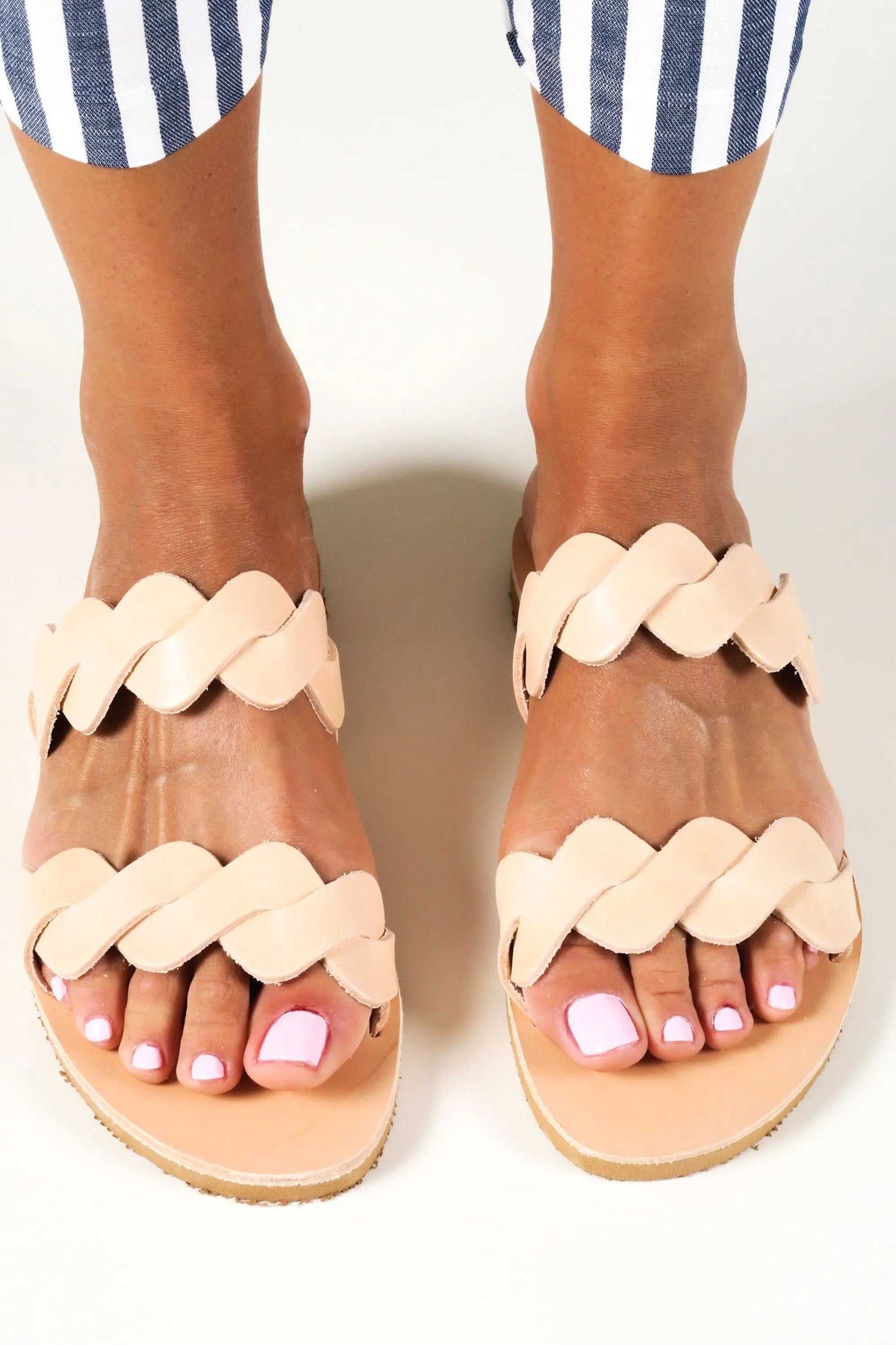 KYMA Handmade Greek Sandals in natural beige leather with layered braided straps and flat tan soles