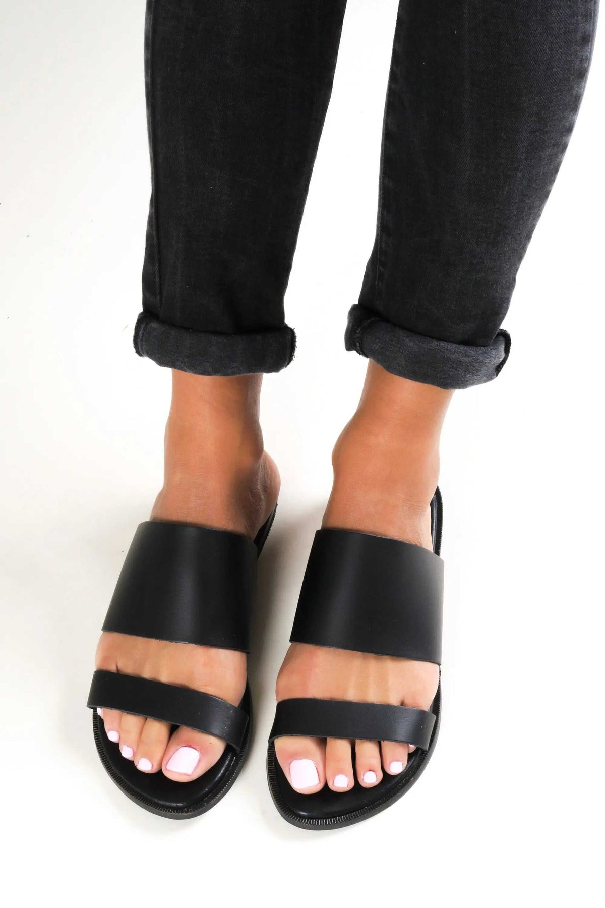 KYTHIRA Handmade Greek Sandals in black leather with broad slip-on straps, open toes and flat soles