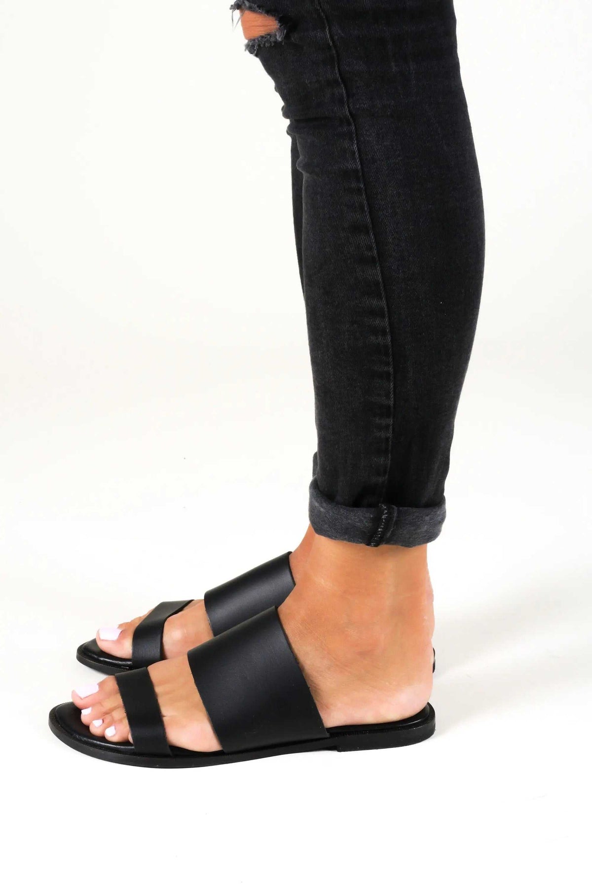 KYTHIRA Handmade Greek Sandals in black leather with wide slip-on straps, open toes and a flat sole