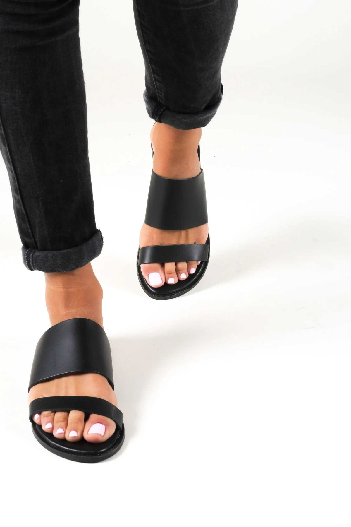 KYTHIRA Handmade Greek Sandals in black leather with wide straps and open toes, featuring slip-on styling