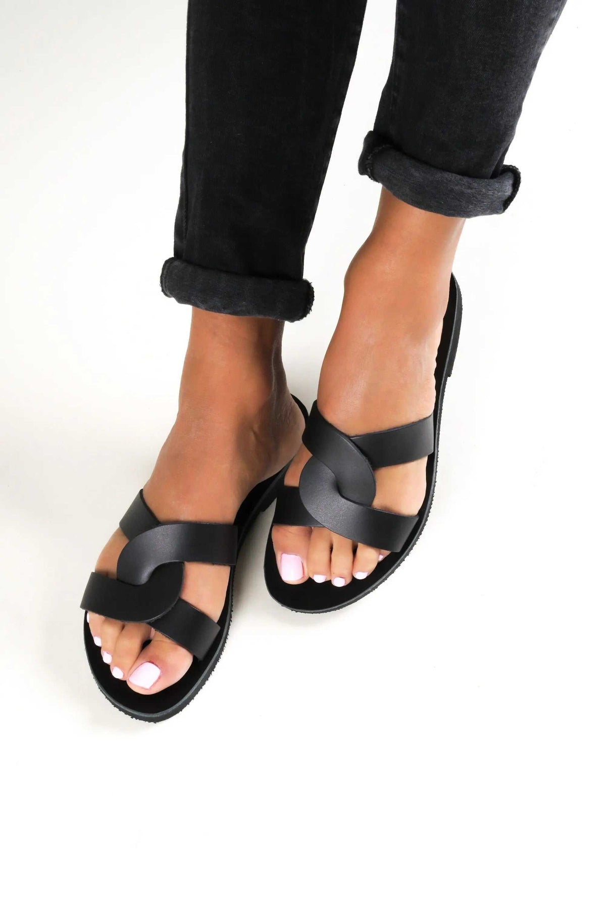 MYRINA Handmade Greek Sandals in black leather with broad interwoven straps and an open-toe flat sole