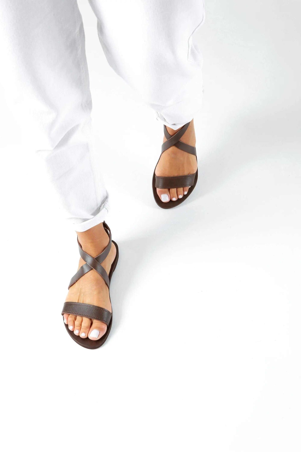 MYRTO Handmade Greek Sandals in dark brown leather with slim crisscross straps and an open toe