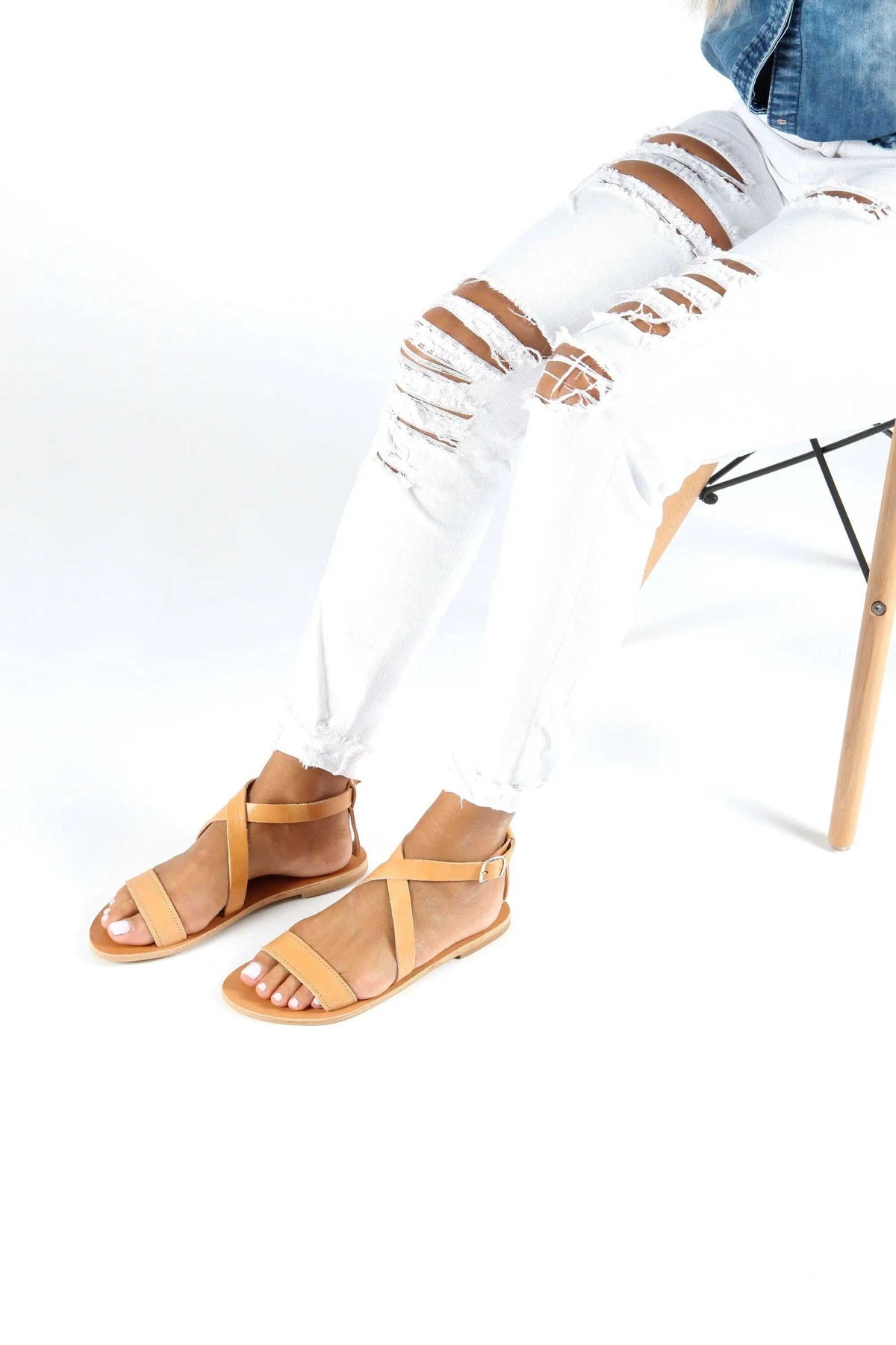 MYRTO Handmade Greek Sandals in natural tan leather with slim crisscross straps, open toes, and flat soles