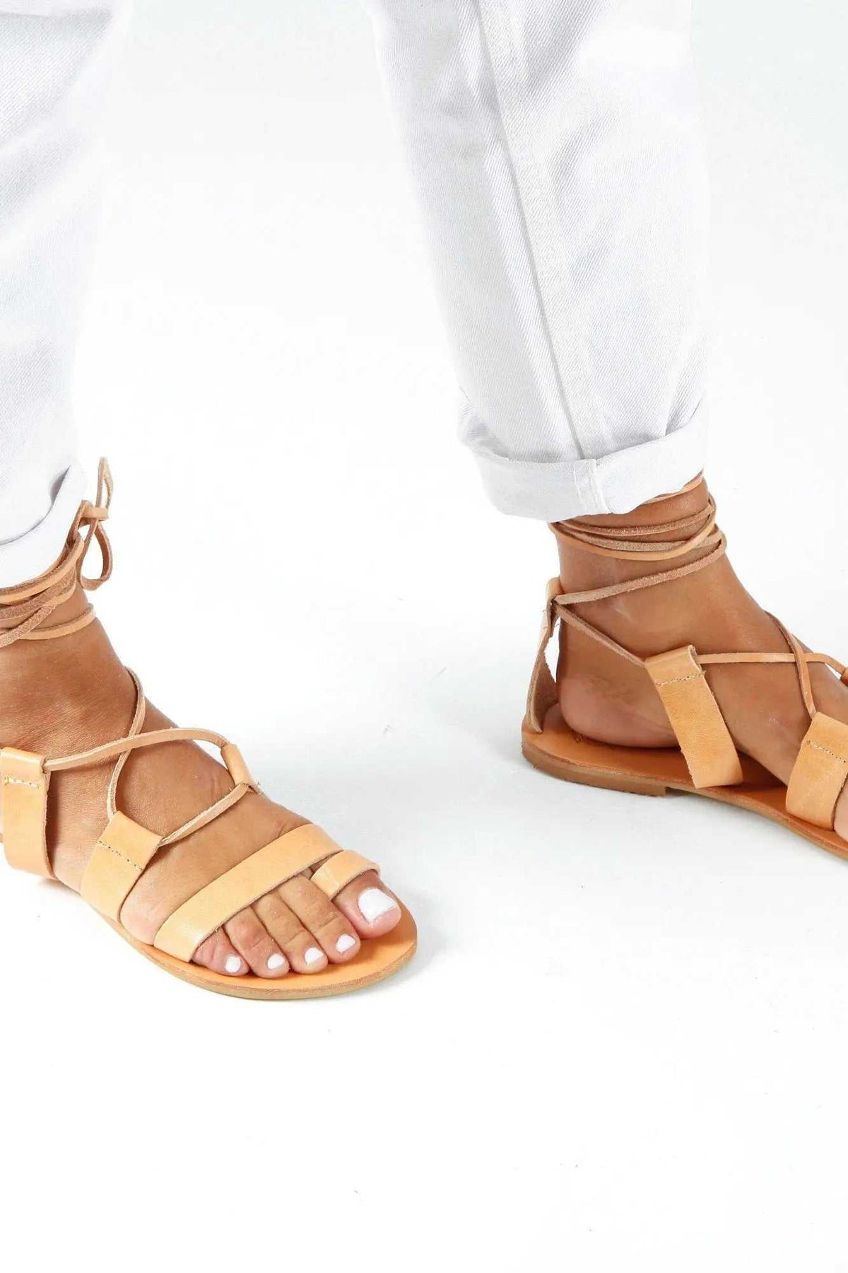 NEFELI Handmade Greek Sandals in tan leather with gladiator straps, rope ties, and open-toe design