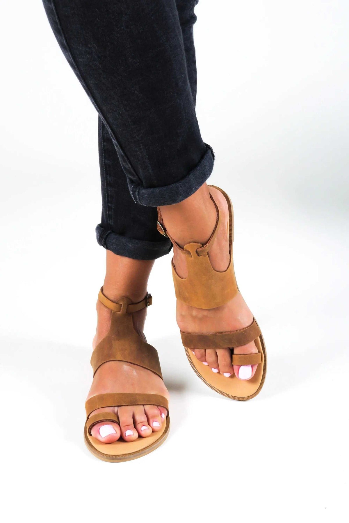 NIKEA Handmade Greek Sandals in tan leather with ankle straps, open toes, and flat soles