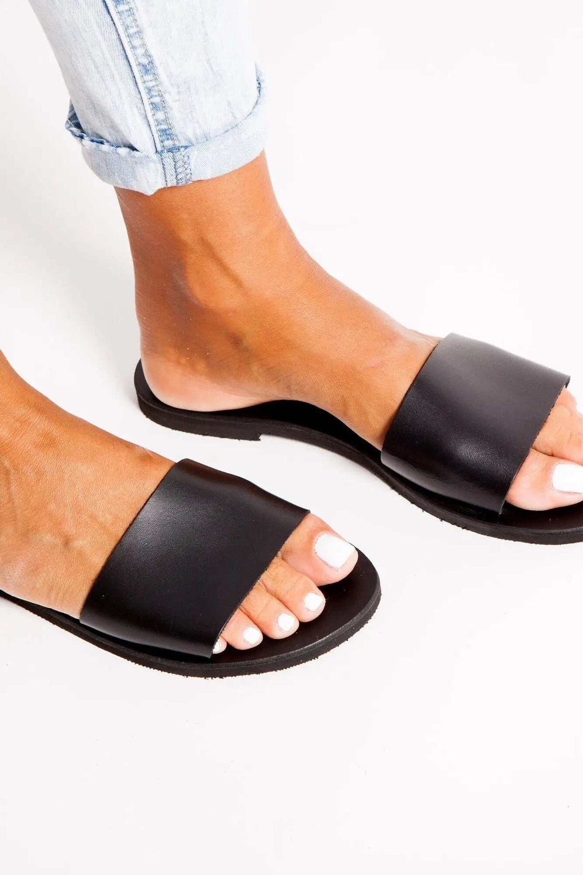 PAROS Handmade Greek Sandals in black leather with wide slip-on straps, open toes and flat rubber soles