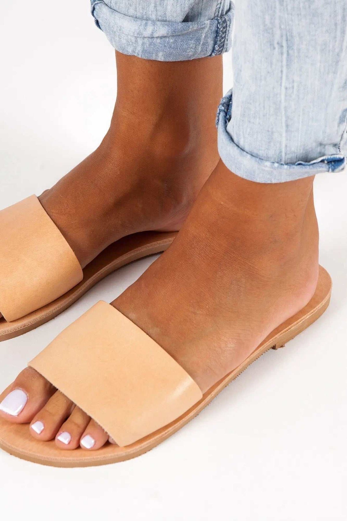 PAROS Handmade Greek Sandals in natural tan leather with wide slip-on straps, flat soles and open toes