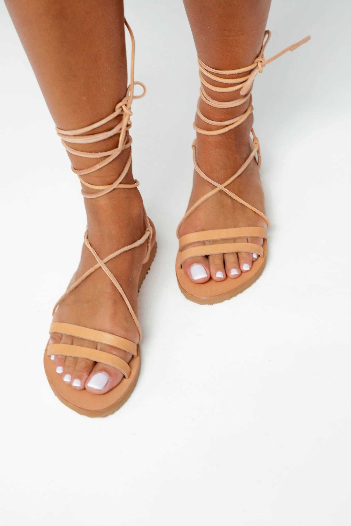 PAXOS Handmade Greek Sandals in natural tan leather with gladiator straps and lace-up ankle ties