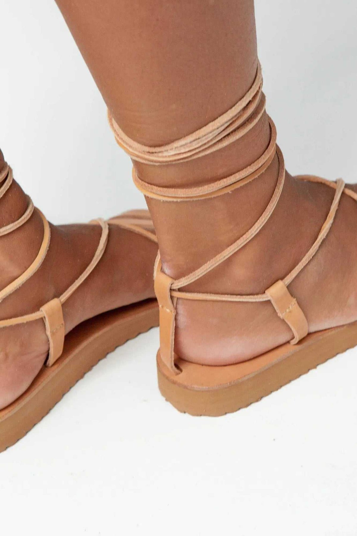 PAXOS Handmade Greek Sandals in natural tan leather with wraparound gladiator straps and rubber soles