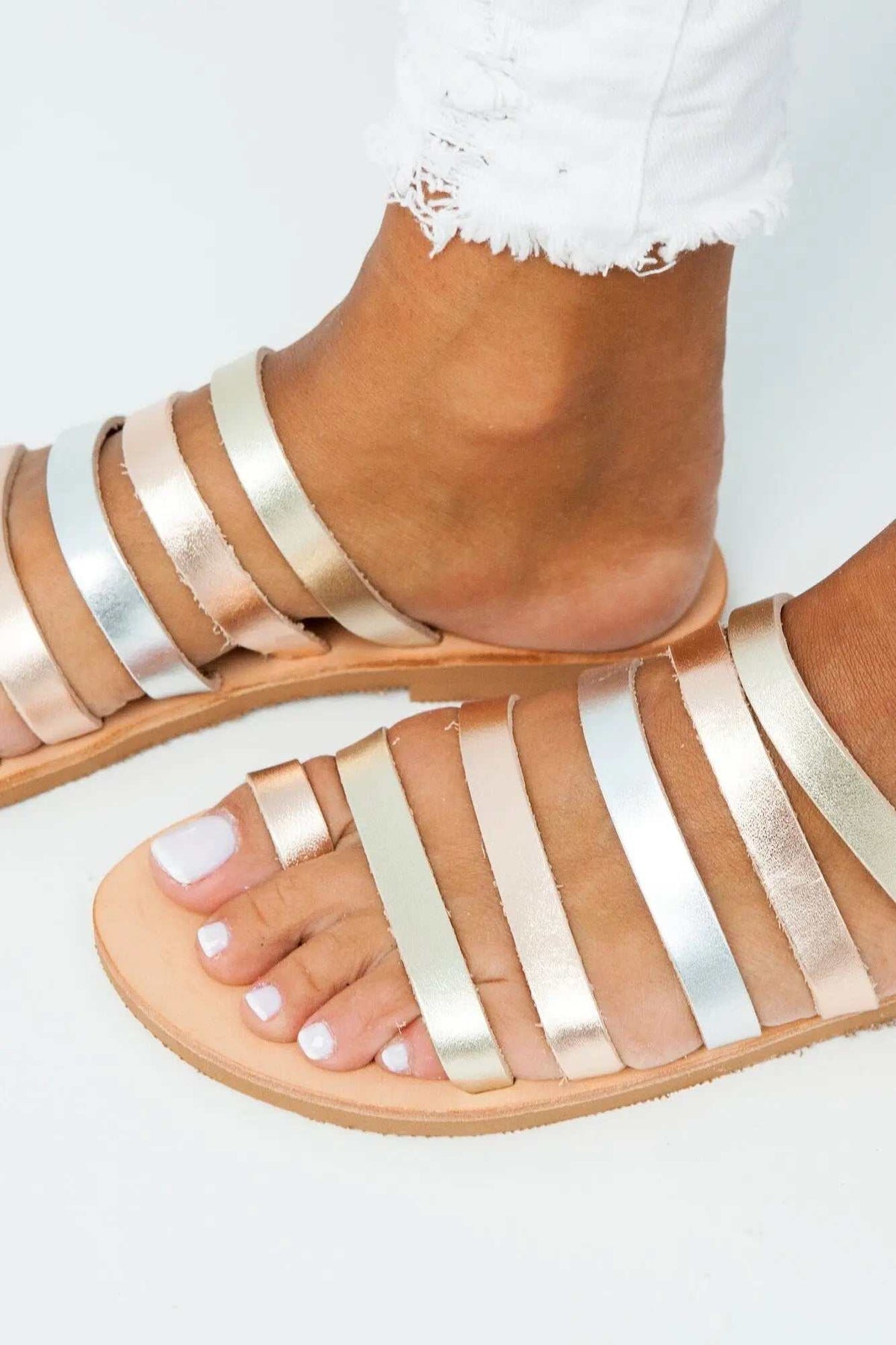 SANTORINI Handmade Greek Sandals with tan leather soles and multiple metallic silver and rose-gold straps