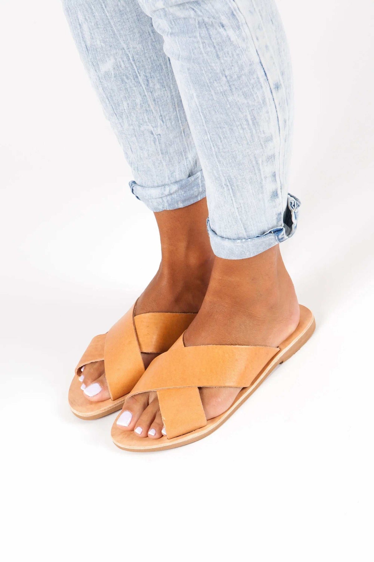 SIFNOS Handmade Greek Sandals in tan leather, featuring wide crisscross straps, open toes, and flat soles.