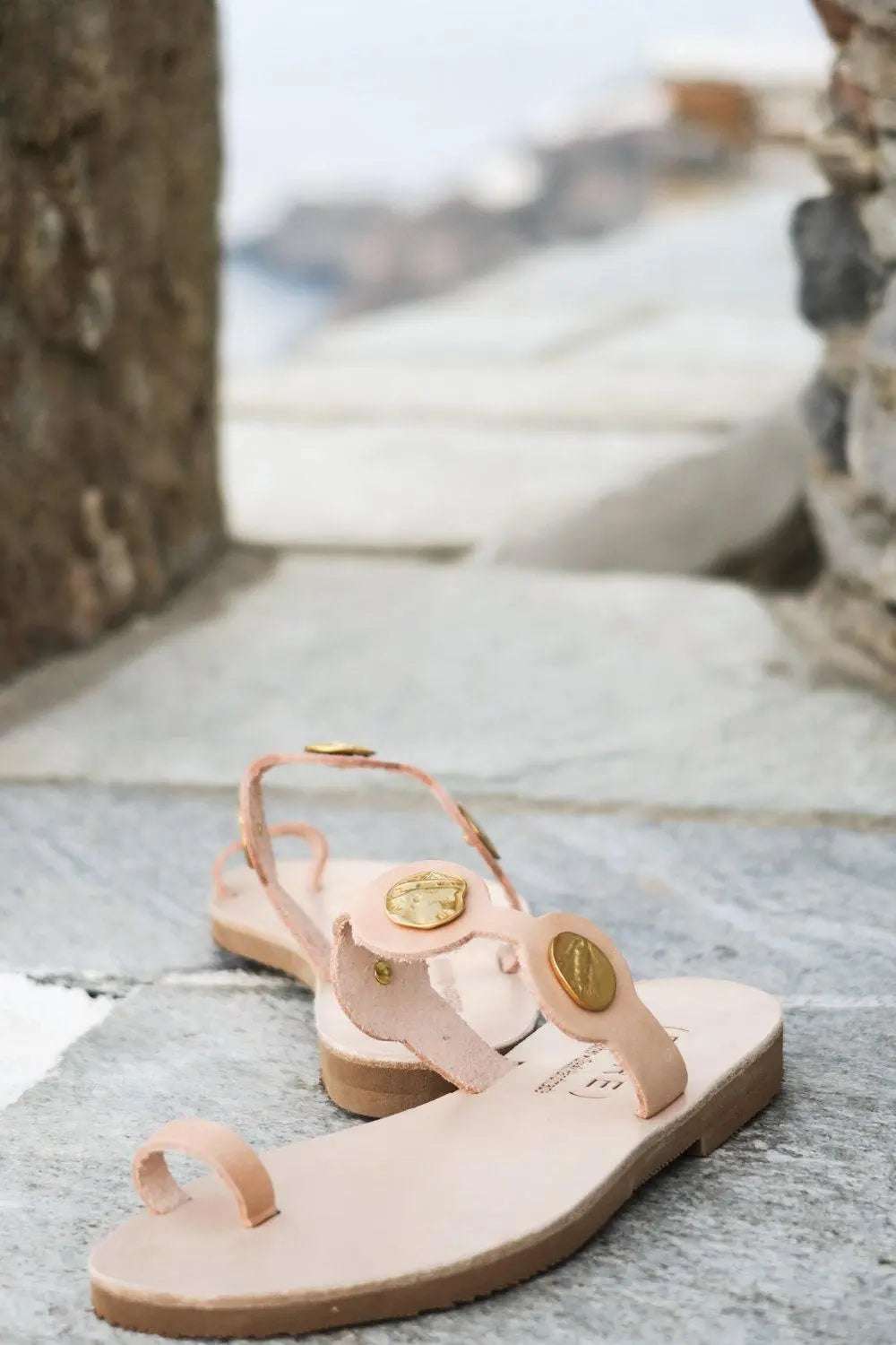 THEA Handmade Greek Sandals in blush pink leather with gold medallion ornaments and toe straps