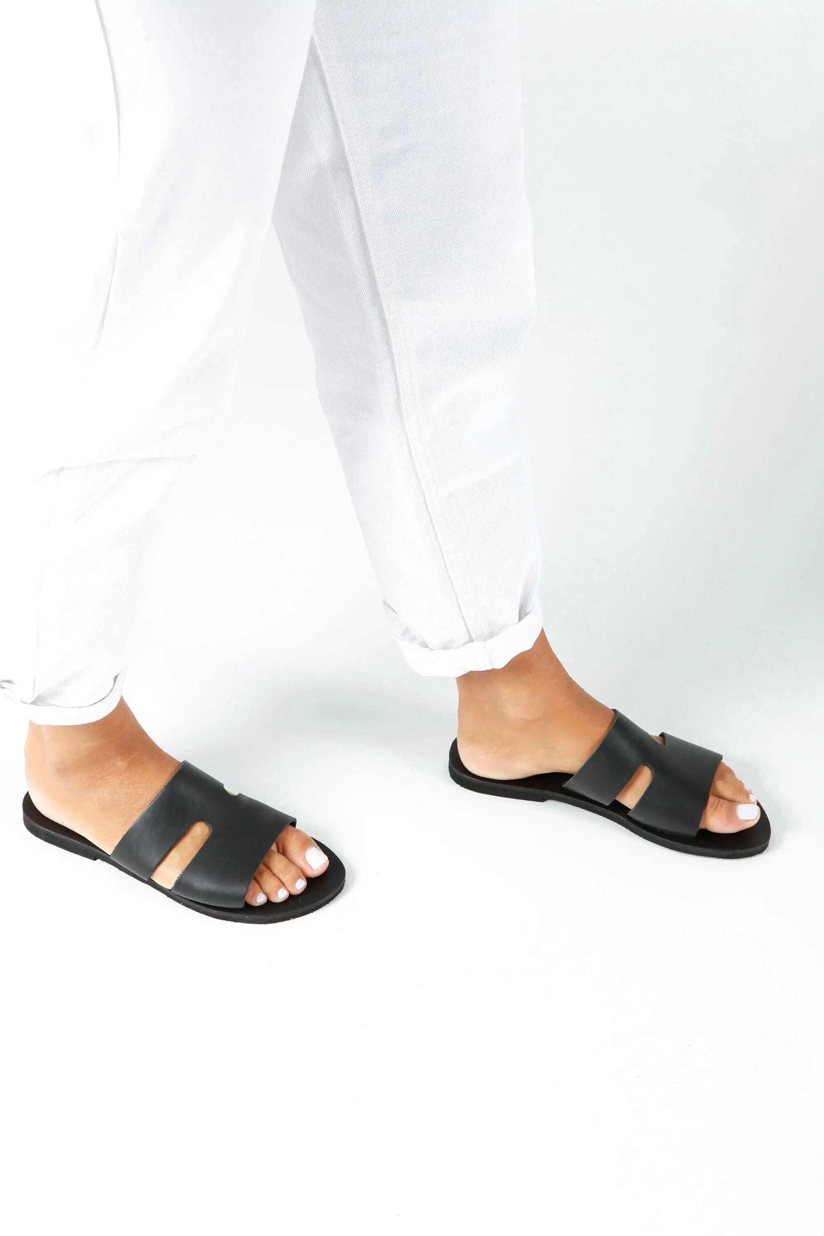 VOTSALO Handmade Greek Sandals in black leather, with wide straps, open toes and flat soles