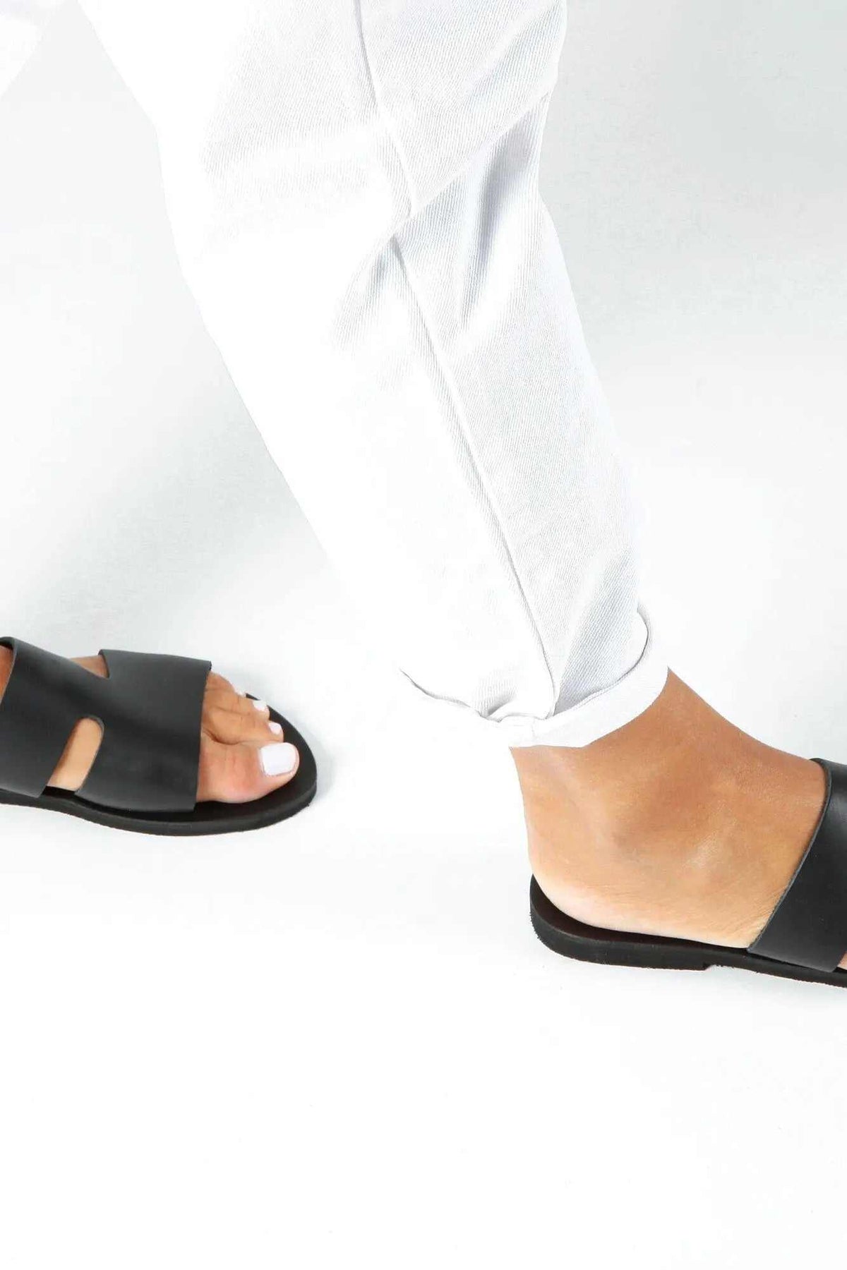 VOTSALO Handmade Greek Sandals in black leather with wide straps, flat soles and an open-toe slip-on design