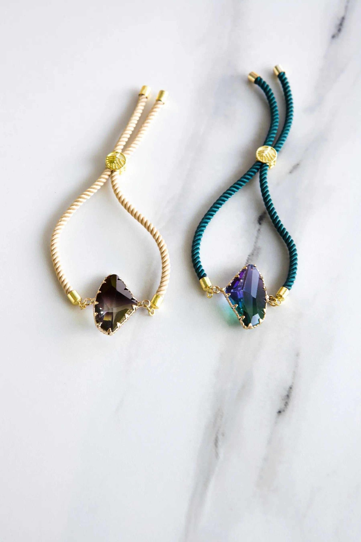 Adjustable Crystal Bracelet with faceted dark crystals, twisted cream and teal cords, and gold-tone fittings