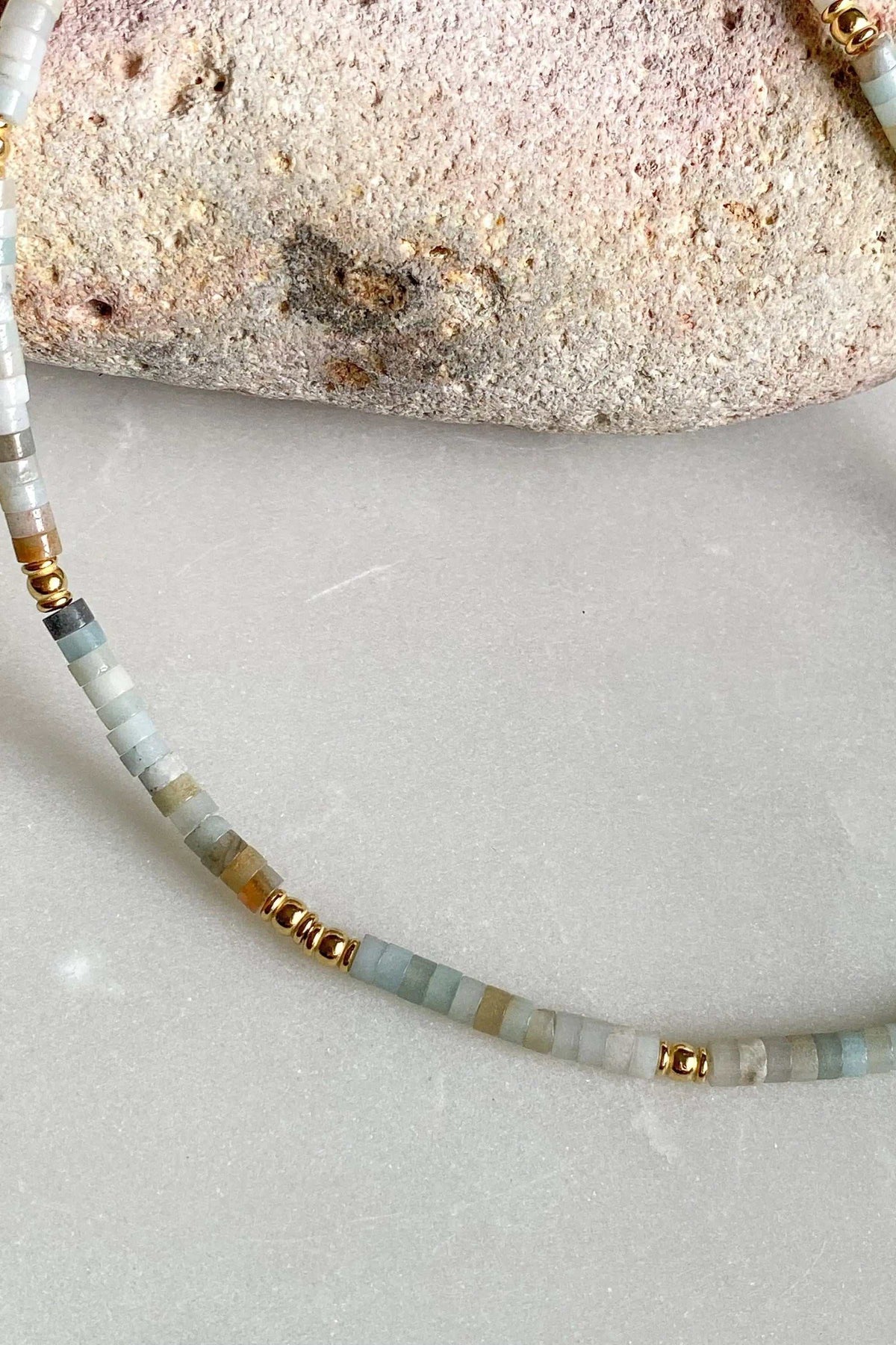 AELIA NECKLACE aquamarine beaded necklace with pale blue and white beads and gold-plated accents