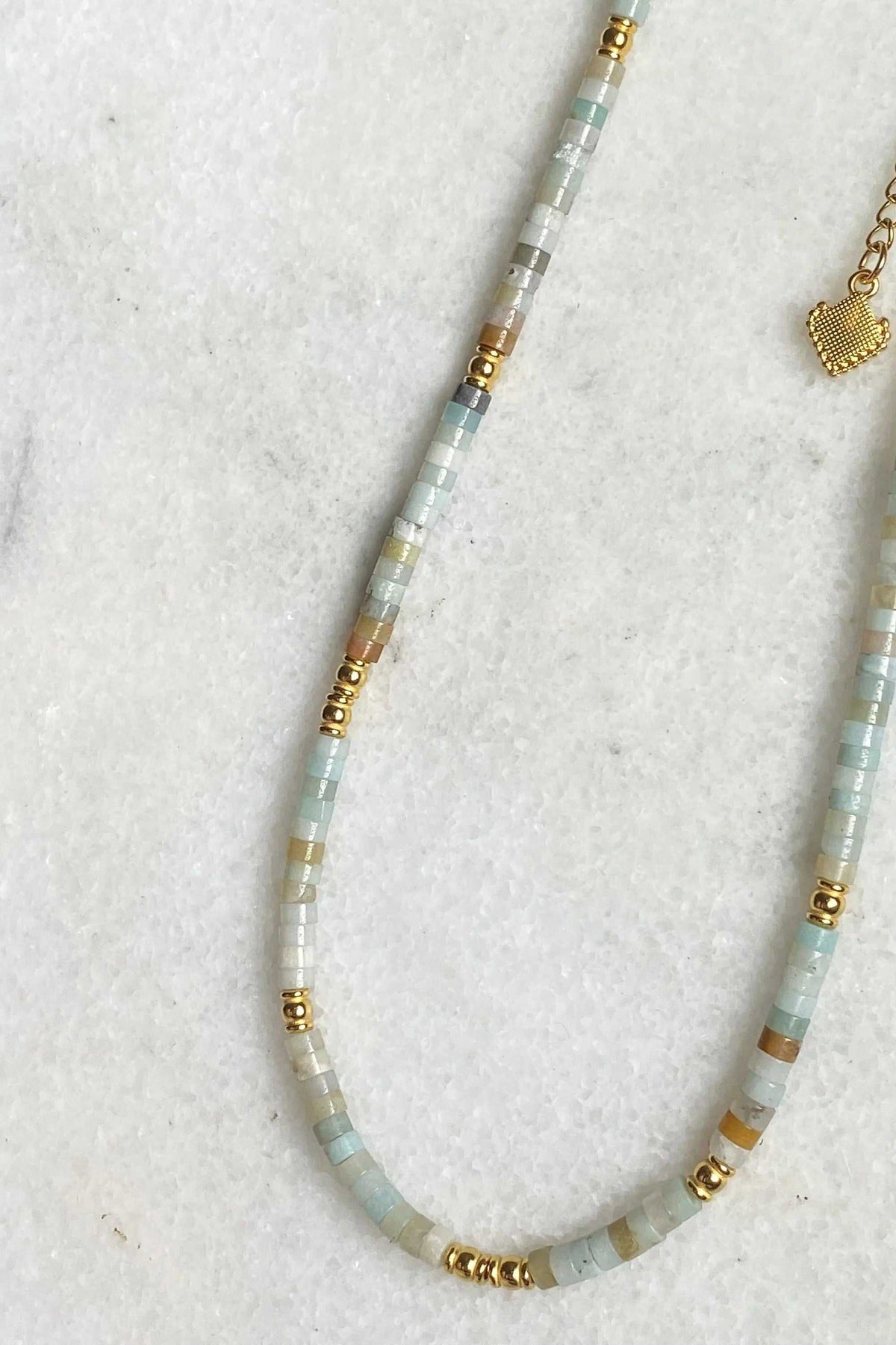 AELIA NECKLACE with pale aquamarine beads, gold-plated accents, and a delicate extender chain