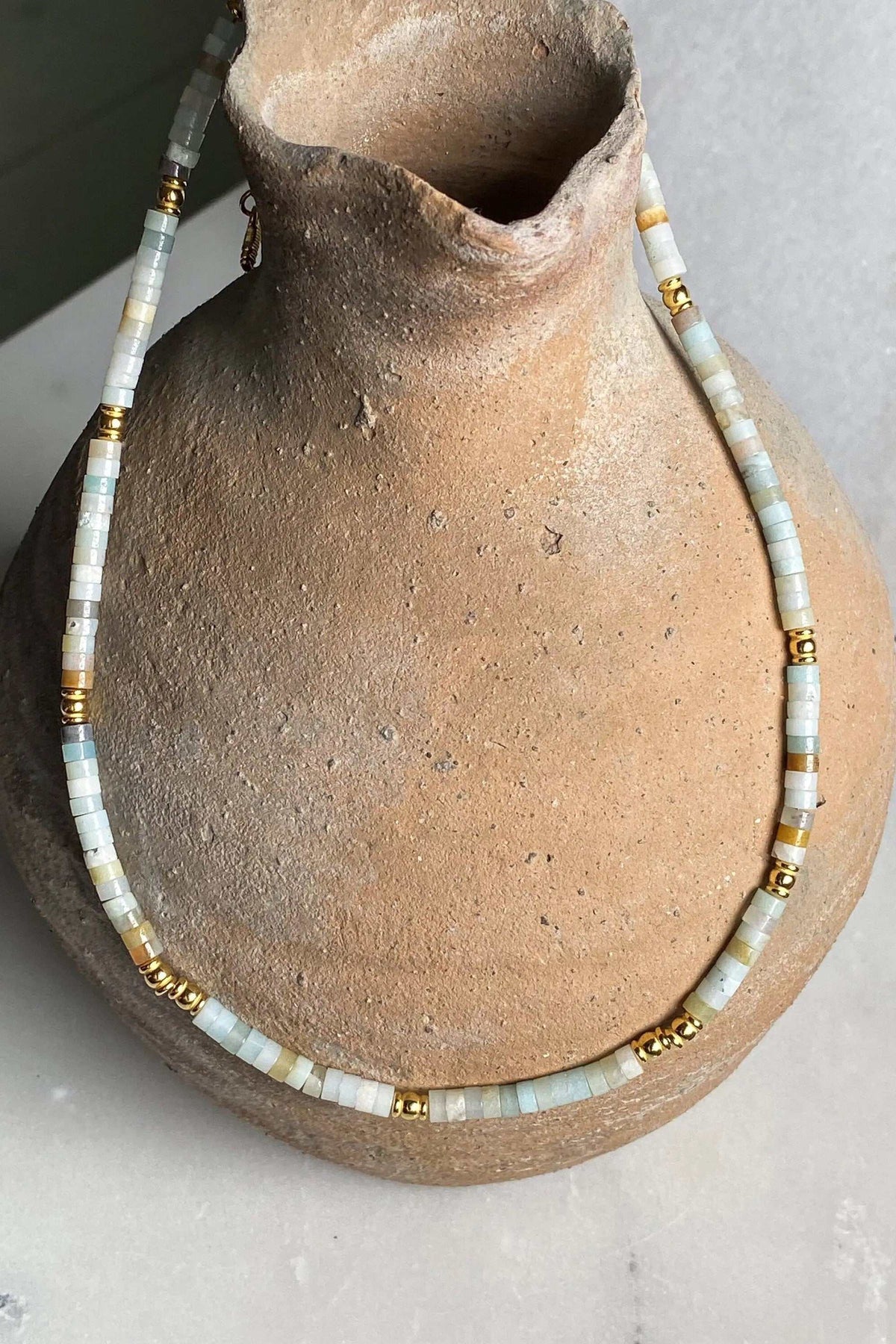 AELIA NECKLACE aquamarine beaded necklace with gold-plated details and a delicate extender chain