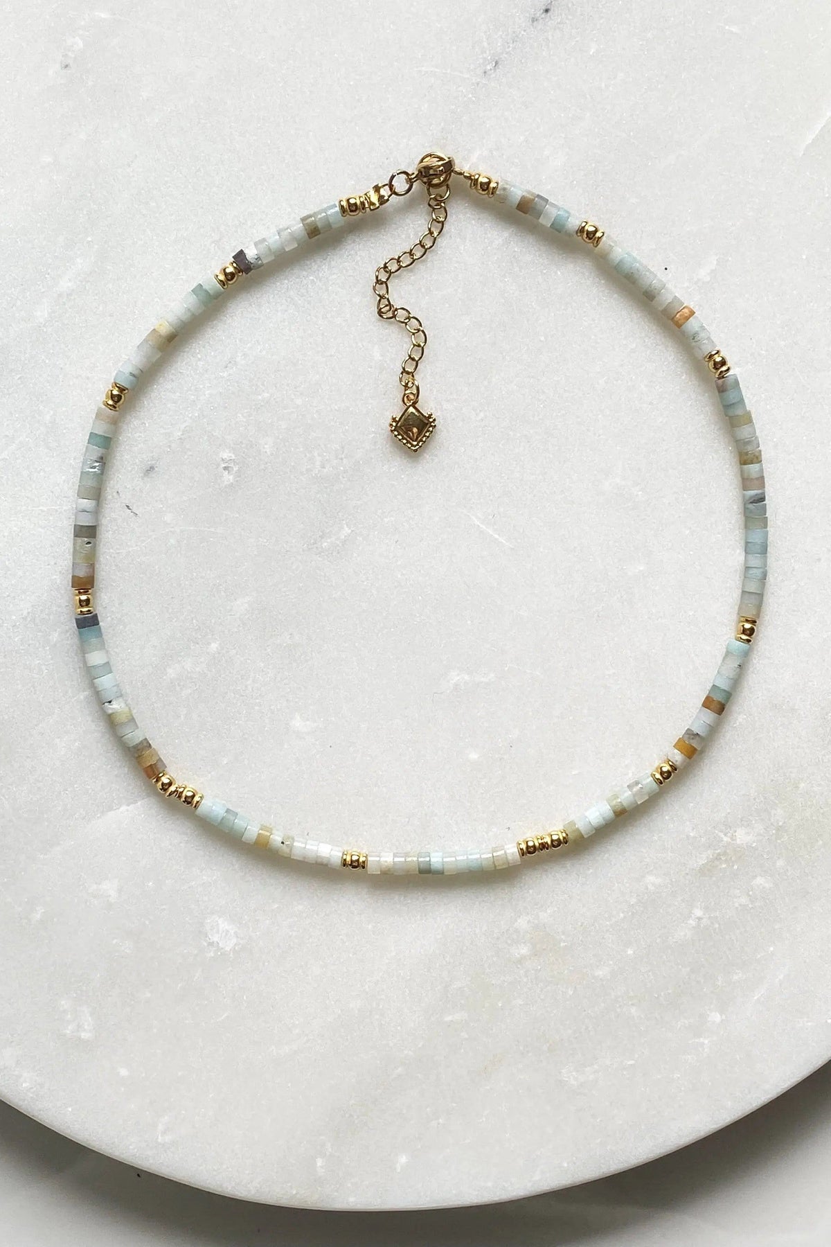 AELIA NECKLACE aquamarine beaded necklace with gold-plated details and dangling extender charm