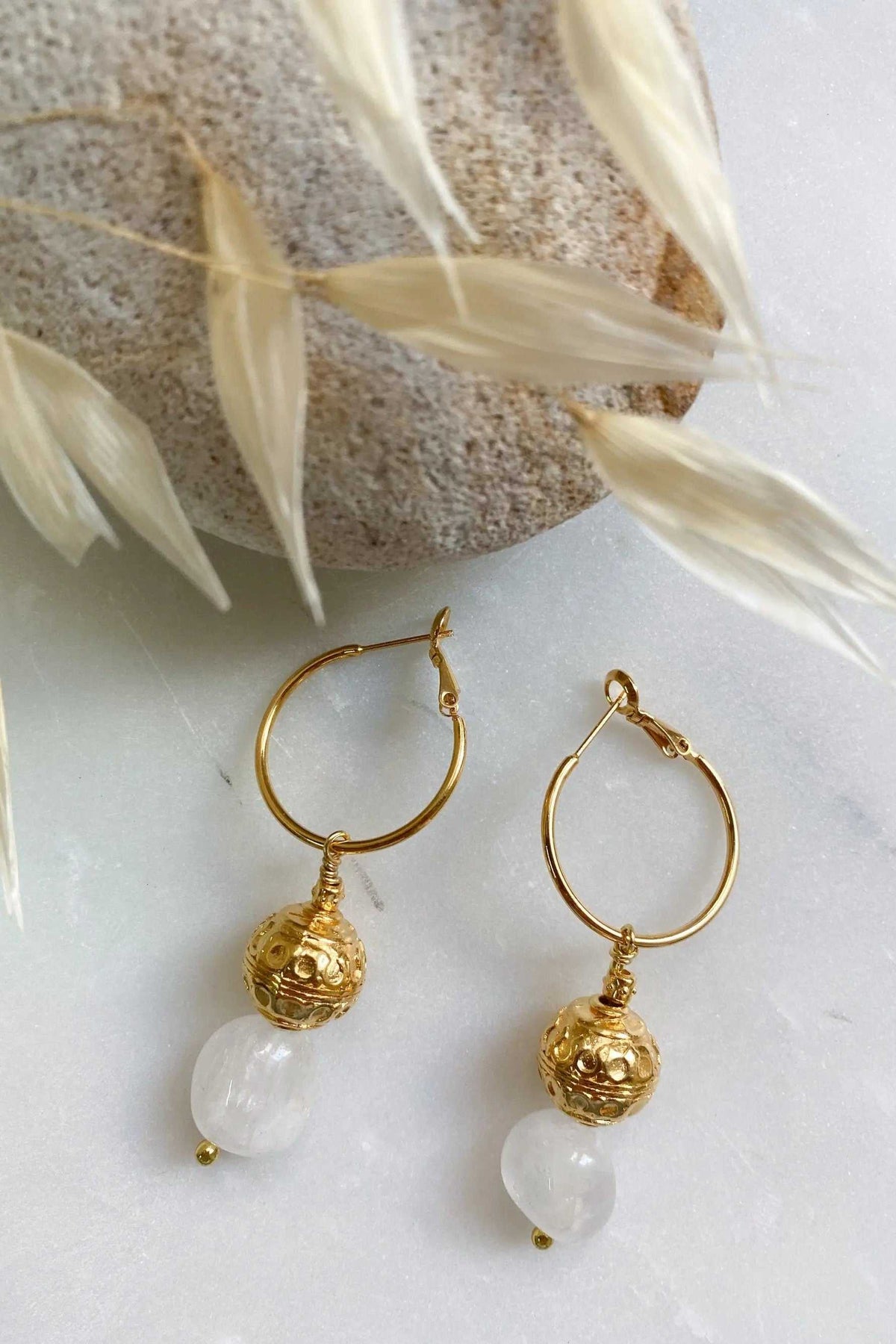 AGAPE EARRINGS gold hoop earrings with ornate charm and translucent white quartz stone pendants