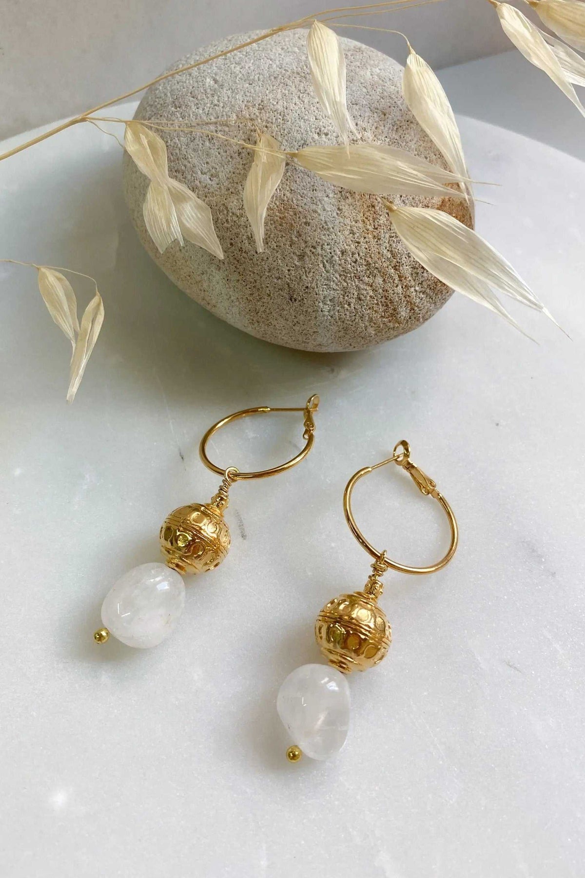 AGAPE EARRINGS, gold-tone hoop earrings with ornate textured bead charms and dangling white quartz stones