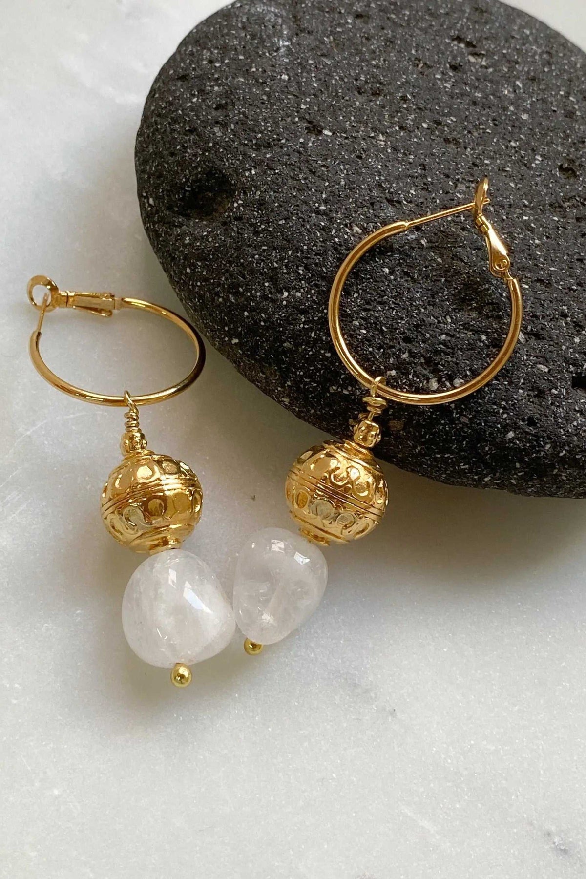 AGAPE EARRINGS gold-tone hoop earrings with textured spherical charms and translucent white stone beads