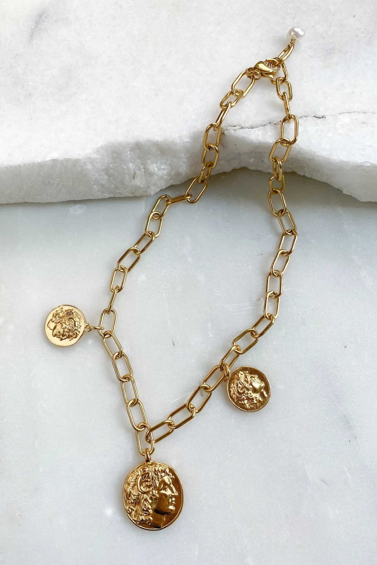 Alexander Charm Bracelet in gold-tone metal with chunky elongated links and three embossed ancient coin charms