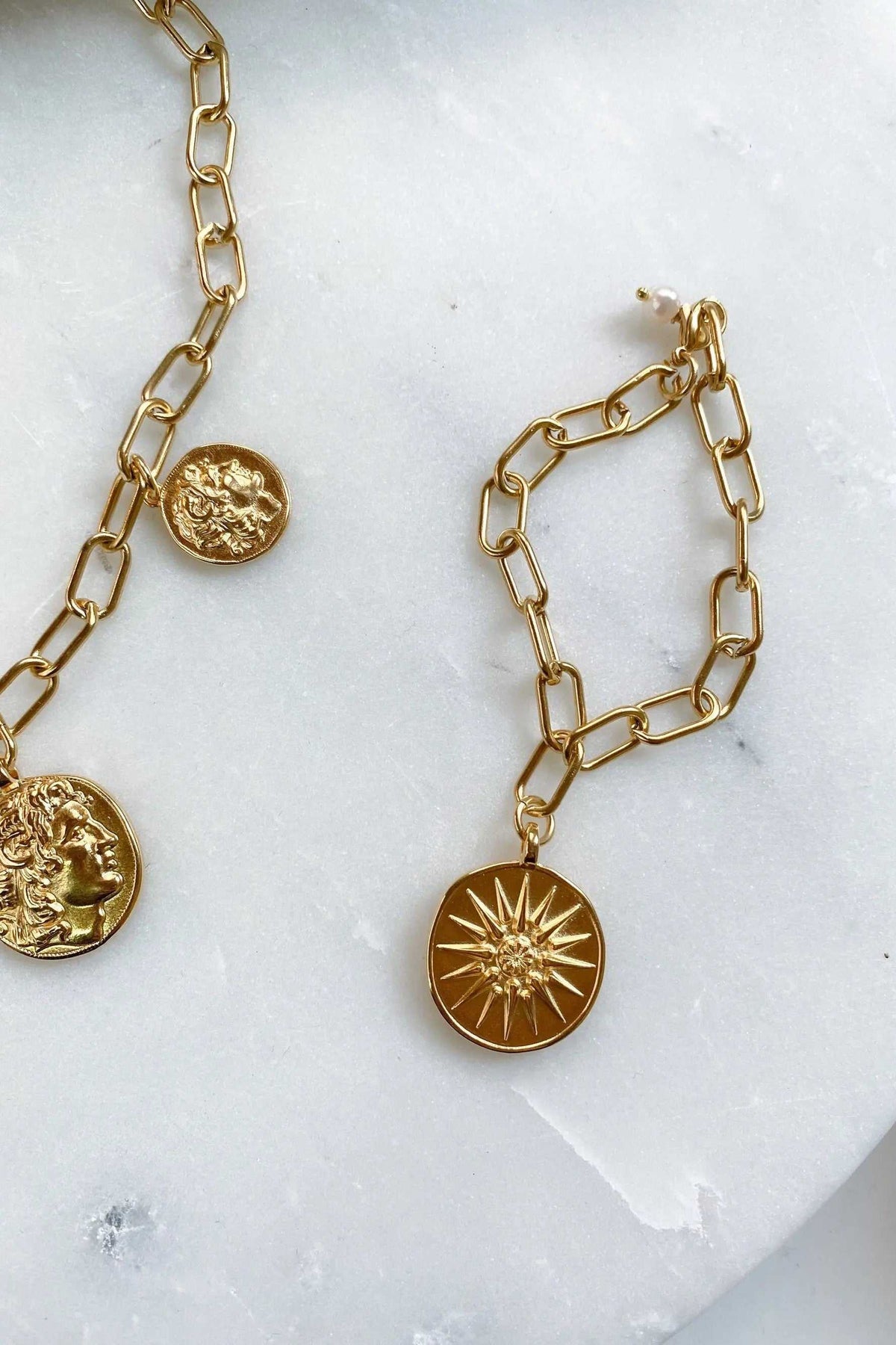 Alexander Charm Bracelet in gold-tone steel with chunky paperclip links and round ancient Greek coin charms